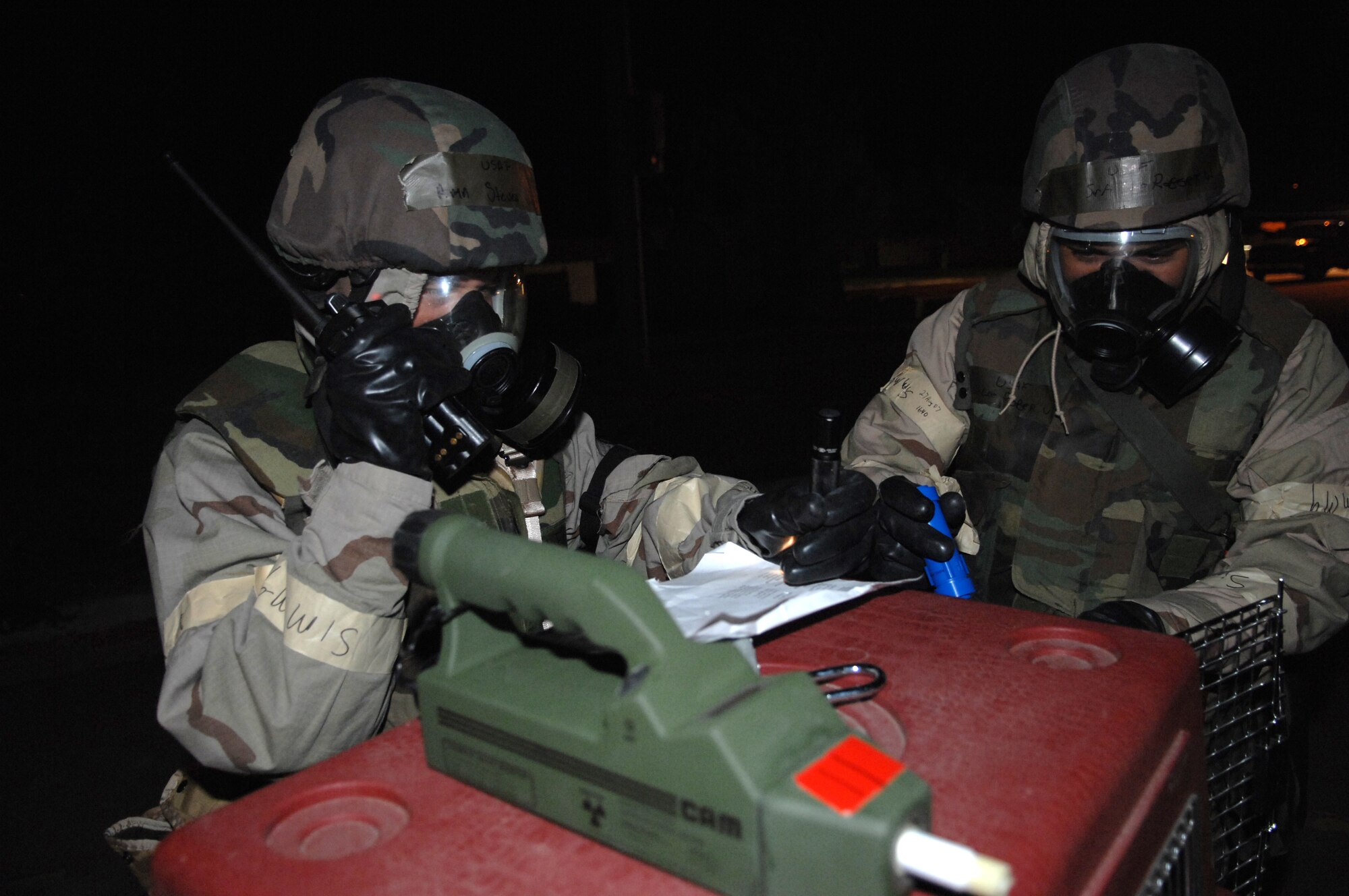 MOUNTAIN HOME AIR FORCE BASE, Idaho -- Airmen with the base command post perform a post-attack reconnaissance sweep of their building checking for possible chemical agents during the base’s Sharpshooter exercise Aug. 29. The base conducts these combat readiness exercises to prepare for real world deployments and the wing’s upcoming operational readiness inspection in March 2008. (U.S. Air Force photo/ Airman 1st Class Ryan Crane)