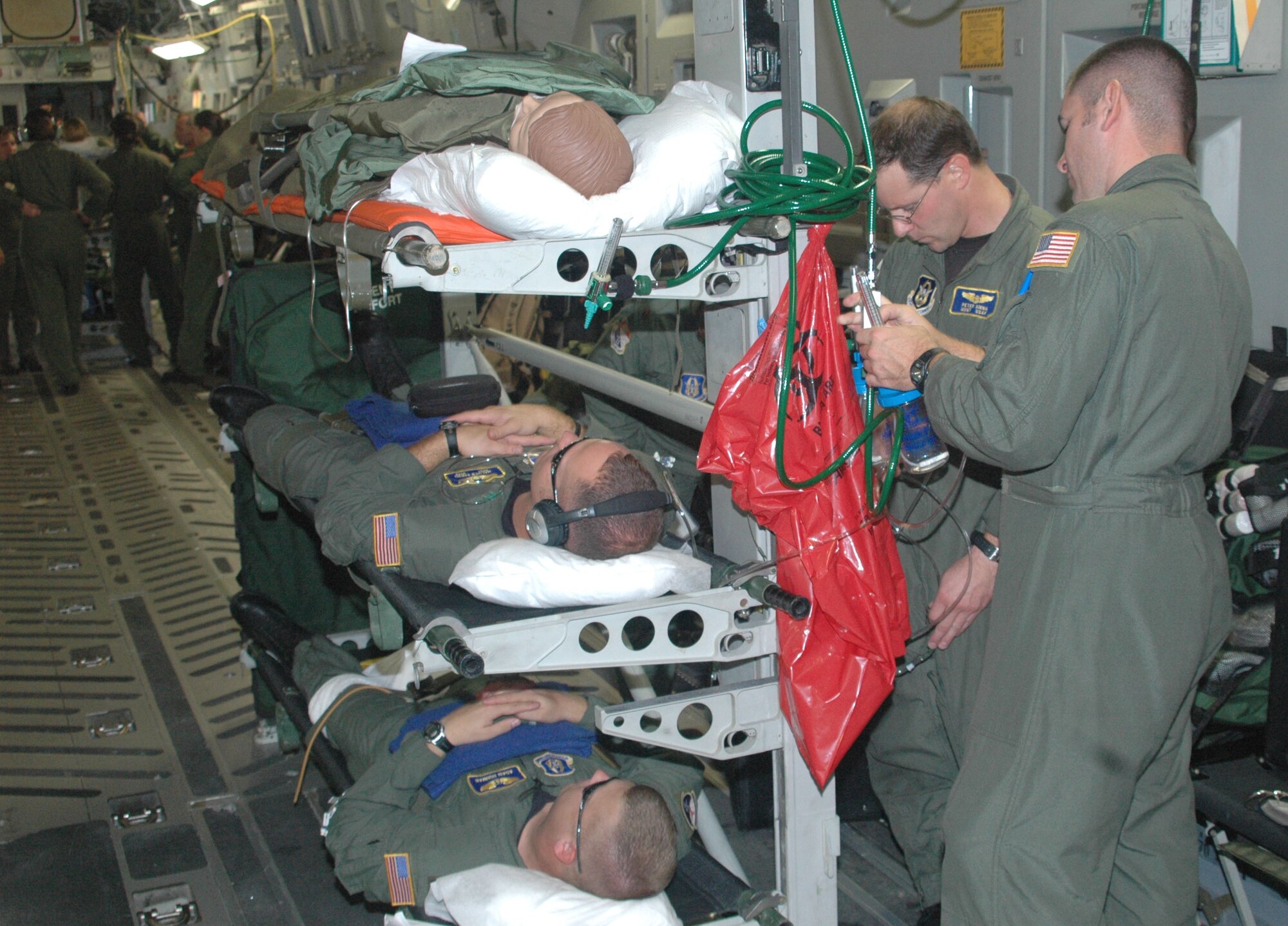 WESTOVER AIR RESERVE BASE, Mass. -- Medical evacuation personnel from five bases tested their patient airlift skills on four different aircraft duing an AE Jamboree held here Aug. 24-26. Mililtary medical staff are shown tending to 'patients' aboard a medevac-configured C-17 Globemaster. (U.S. Air Force photo/Master Sgt. Tom Allocco)