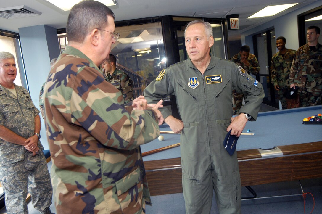 Chaplain (Lt. Col.) Thomas Fey, briefs General Bruce Carlson, Air Force Materiel Command commander, about the Airmen's Ministry at Robins Monday. U. S. Air Force photo by Sue Sapp