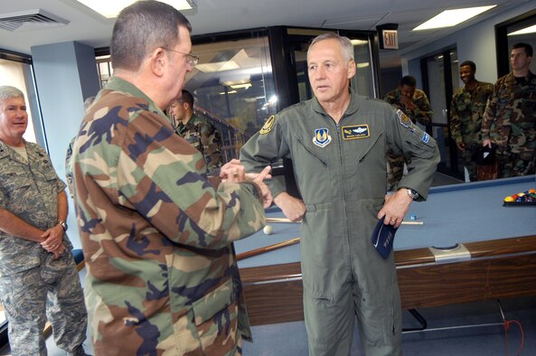 Chaplain (Lt. Col.) Thomas Fey, briefs General Bruce Carlson, Air Force Materiel Command commander, about the Airmen's Ministry at Robins Monday. U. S. Air Force photo by Sue Sapp
