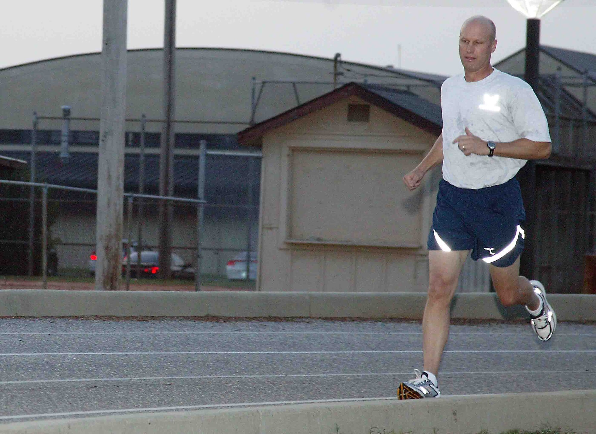 SHAW AIR FORCE BASE, S.C. -- Col. James Post, 20th Fighter Wing commander, performs the 1.5-mile run during his annual fitness evaluation Aug. 28 at the Shaw running track. The fitness test is now part of the enlisted and officer performance report. Colonel Post earned a perfect score on his fitness evaluation. (U.S. Air Force photo/Senior Airman John Gordinier)