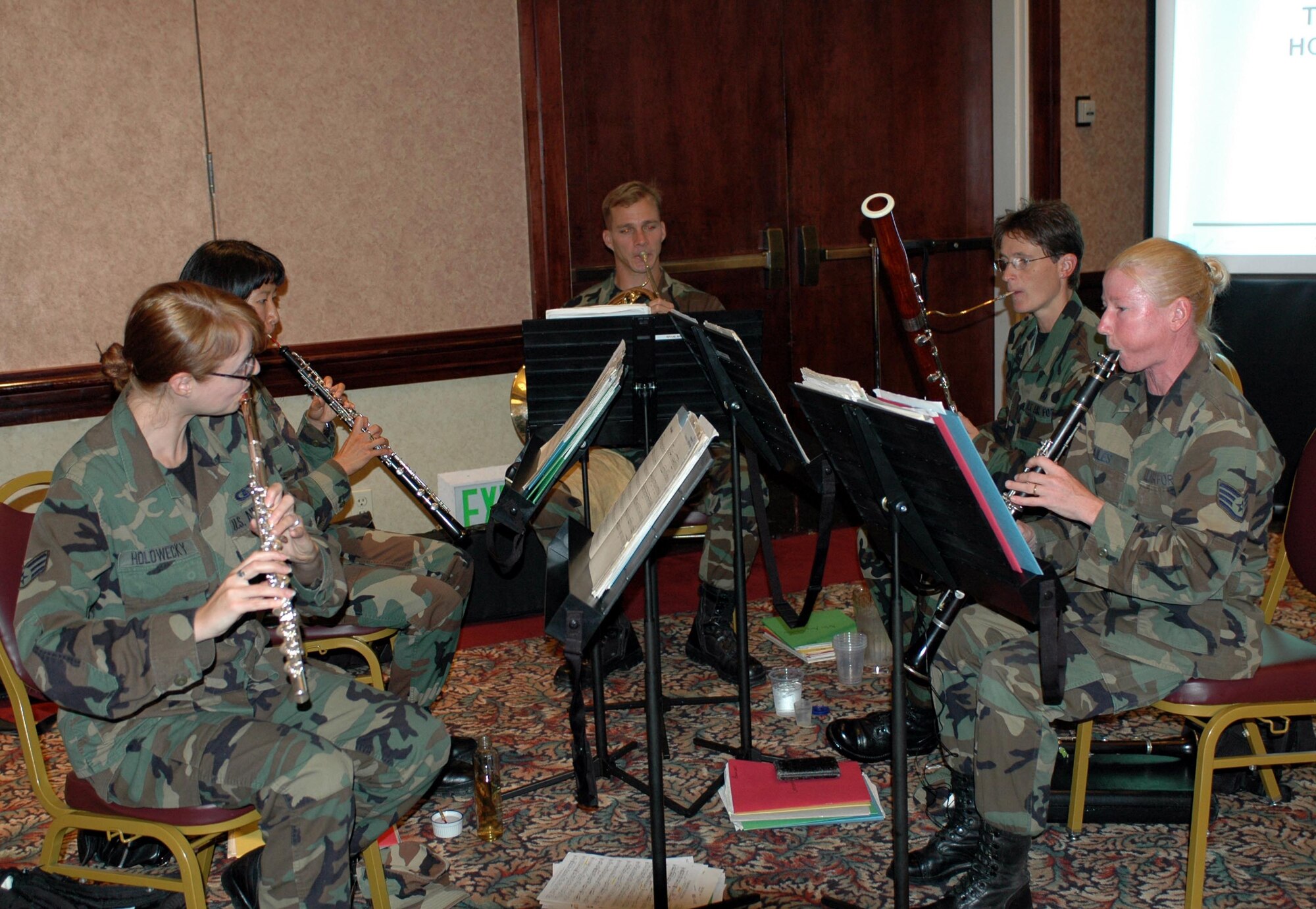 Members of the USAF Band of the Golden West provide accompany music during Travis honorary commanders' assumption-of-command ceremony Aug. 24. (U.S. Air Force photo/Airman 1st Class Kristen Rohrer)
