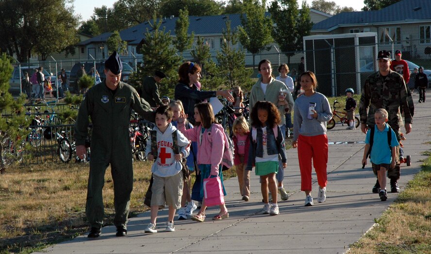 Little Warriors and their parents enter the Loy Elementary School property from the Malmstrom housing area gate on the first morning of school Wednesday. Nearly 95 percent of the children who attend Loy are military family members. (U.S. Air Force photo/Valerie Mullett)