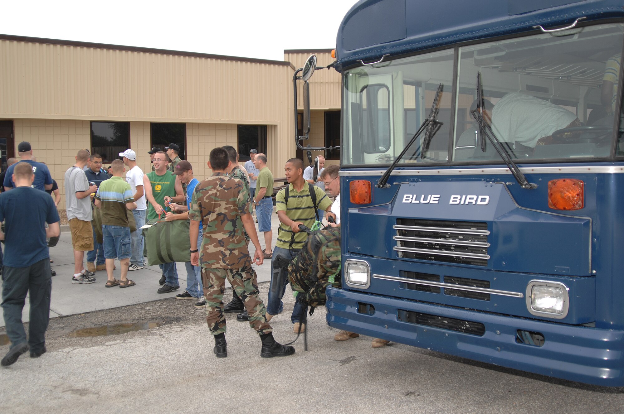 WHITEMAN AIR FORCE BASE, Mo. - Members of the 509th Logistics Readiness Squadron load their baggage prior to departing for convoy training Aug. 25. The LRS vehicle operators will attend a six-week long convoy training course at Camp Bullis, Texas in preparation for their deployment for Kuwait. (U.S. Air Force photo/Senior Airman Lauren Padden)