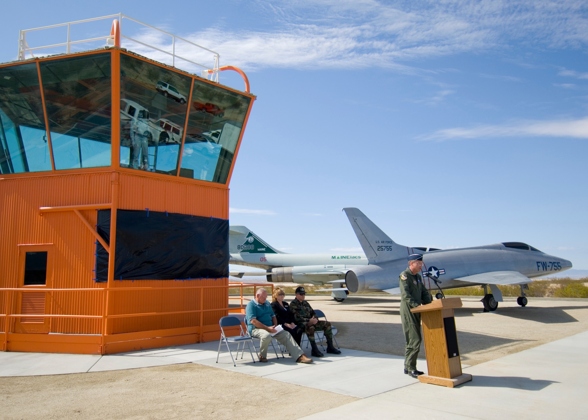 Maj. Gen. Curtis Bedke, Air Force Flight Test Center commander, welcomes attendees to the new Century Circle display during the its opening ceremony at the West Gate on Rosamond Boulevard on Monday. The Century Circle display features a restored 18-foot high and 28-foot wide control tower and six Century Series aircraft, the F-100, F-101, F-102, F-104, F-105 and F-106. (Photo by Mike Cassidy)