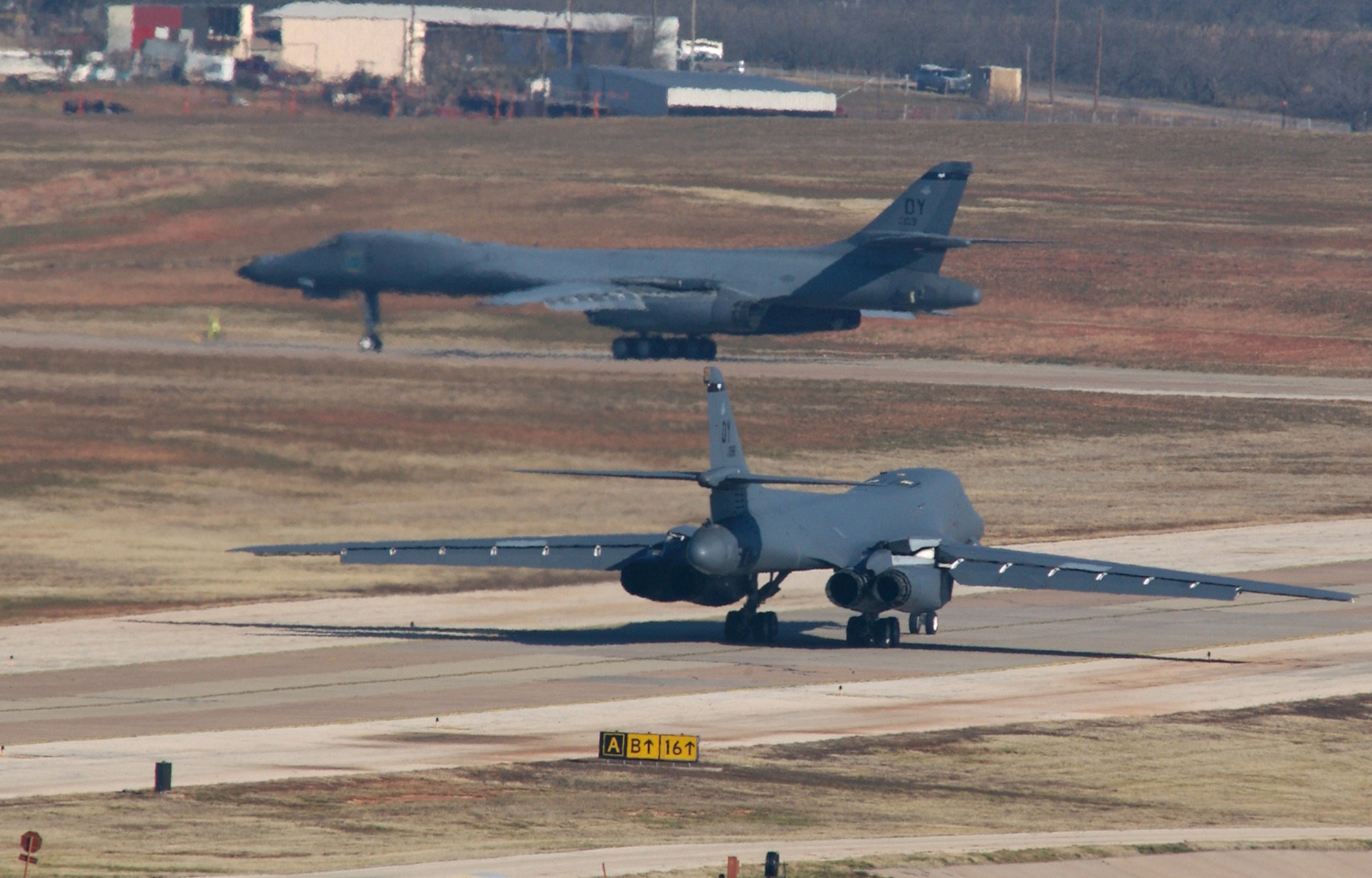Dyess B-1 bombers taxi for take-off March 6. Beginning in mid-September 2007, 20 of Dyess' B-1s will be temporarily relocated to Ellsworth AFB, S.D., so that Dyess' runway can be repaired. (U.S. Air Force Photo by Staff Sgt. Adam Wooten)
