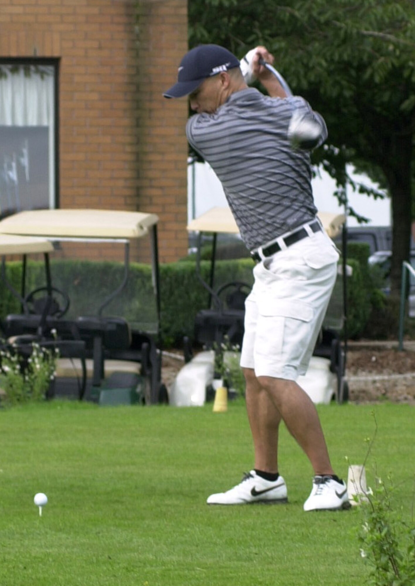 Rick Vallejo, 100th Logistics Squadron drives of the 10th tee in the semi-finals of intramural golf at Breckland Pines Golf Club, Aug. 28. (Air Force photo by Gary Rogers) 