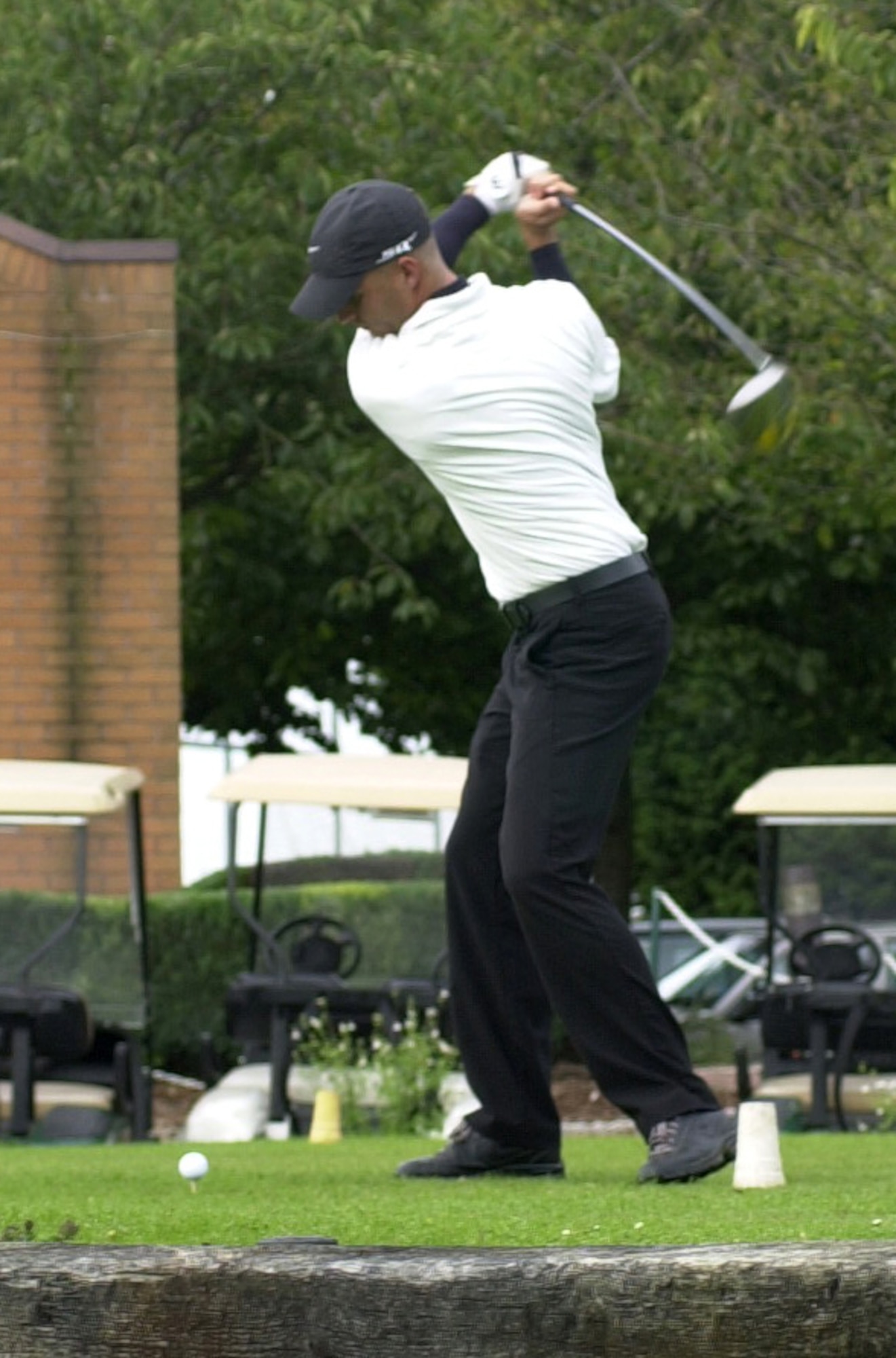 Antonio Barranca, 100th Aircraft Maintenance Squadron drives of the 10th tee in the semi-finals of intramural golf at Breckland Pines Golf Club, Aug. 28. (Air Force photo by Gary Rogers)