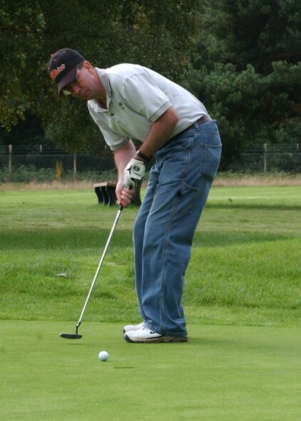 Rich Coyle, playing for the 100th Mission Support Squadron holes out on the seventh green in the semi-finals of intramural golf at the Breckland Pines Golf Club, Aug. 28. (Air Force photo by Airman Brad Smith)