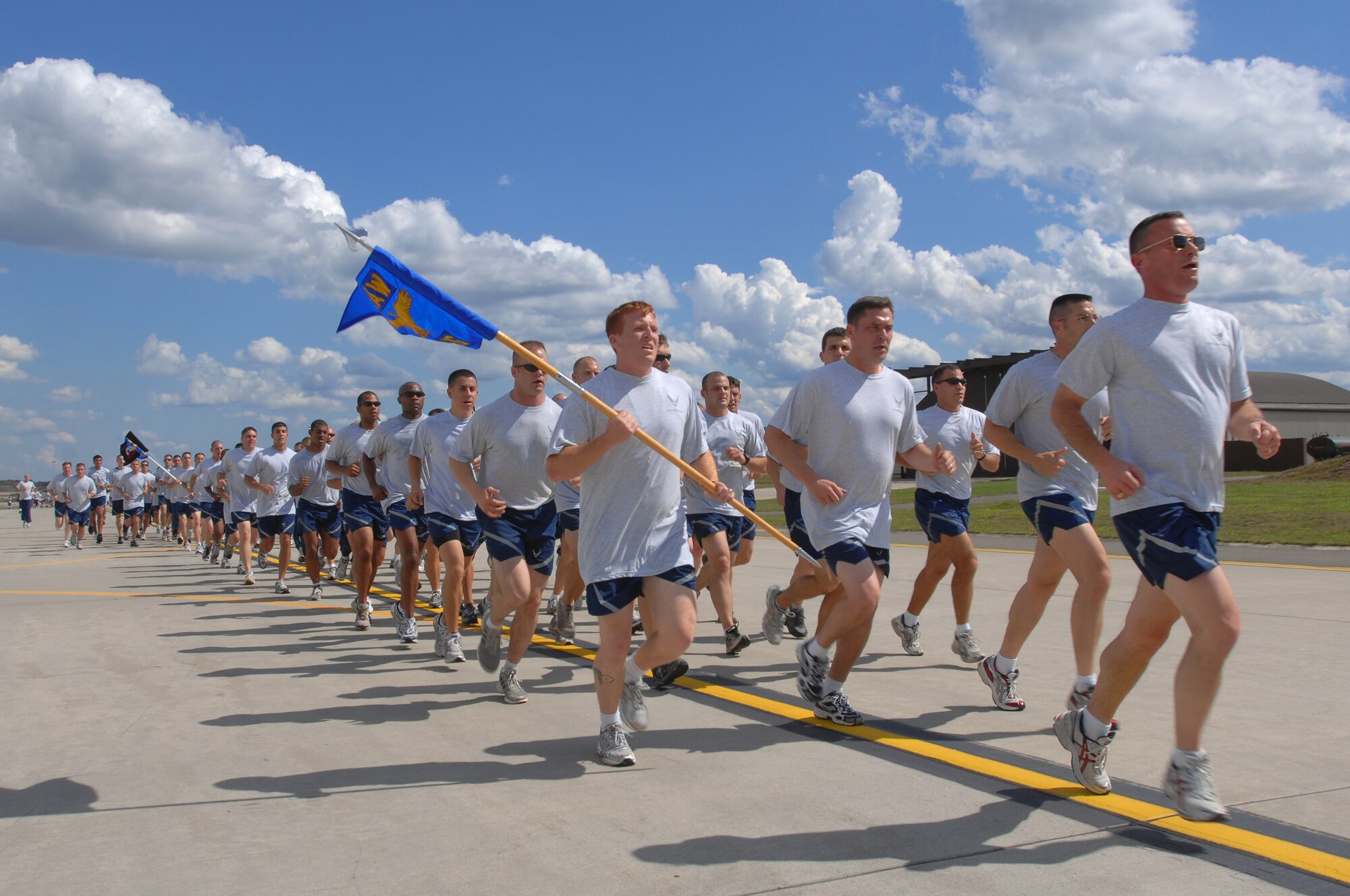 The 86th Airlift Wing participates in a motivational mile and a half run on the flight line, August 24, 2007, Ramstein Air Base, Germany. (U.S. Air Force photo/ Airman 1st Class Kenny Holston)