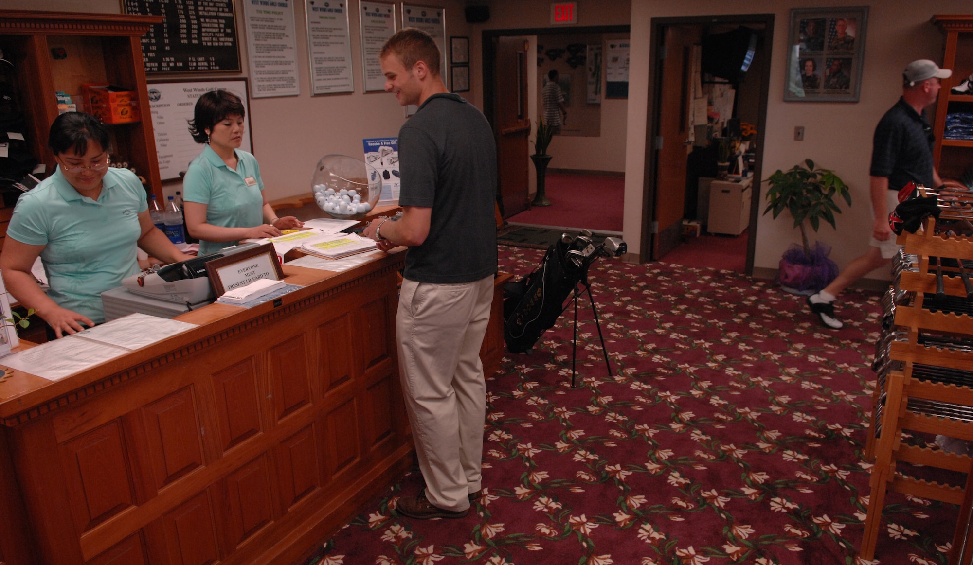 KUNSAN AIR BASE, South Korea -- Choe, Mi Chae and Ms. Kim, Kyong Im (left to right), cashiers at the West Winds Golf Course, register Chris Clauson, Target Intelligence Analyst with the 8th Operations Support Squadron, for the Korean American Golf Association (KAGA) golf tournament here Aug. 25. KAGA, a member of the Kunsan Air Base Good Neighbor Program, has sponsored the golf tournament for Kunsan Airmen for 30 years. Sixty-five players participated in this year’s tournament. (U.S. Air Force photo/Tech. Sgt. Quinton Burris) 


