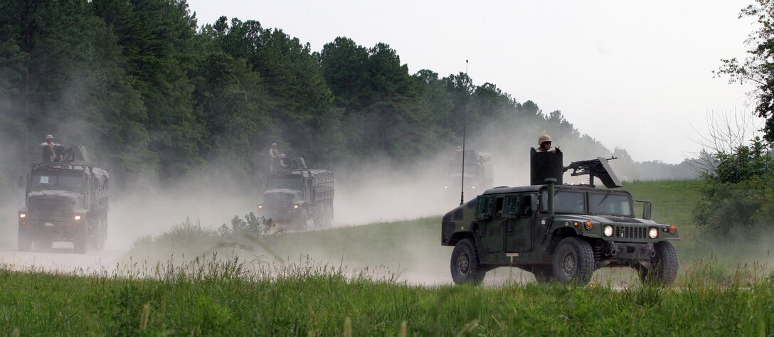 Marines with Combat Logistics Battalion 24 (CLB 24), attached to the 24th Marine Expeditionary Unit (24th MEU), perform a series of live fire runs on a convoy range at Fort Pickett, VA firing M249 and M240 machine guns at targets along the road side. Training like this will prepare the Marines for possible convoy missions in a combat environment. (US Marine Corps photo by Corporal Andrew J. Carlson)