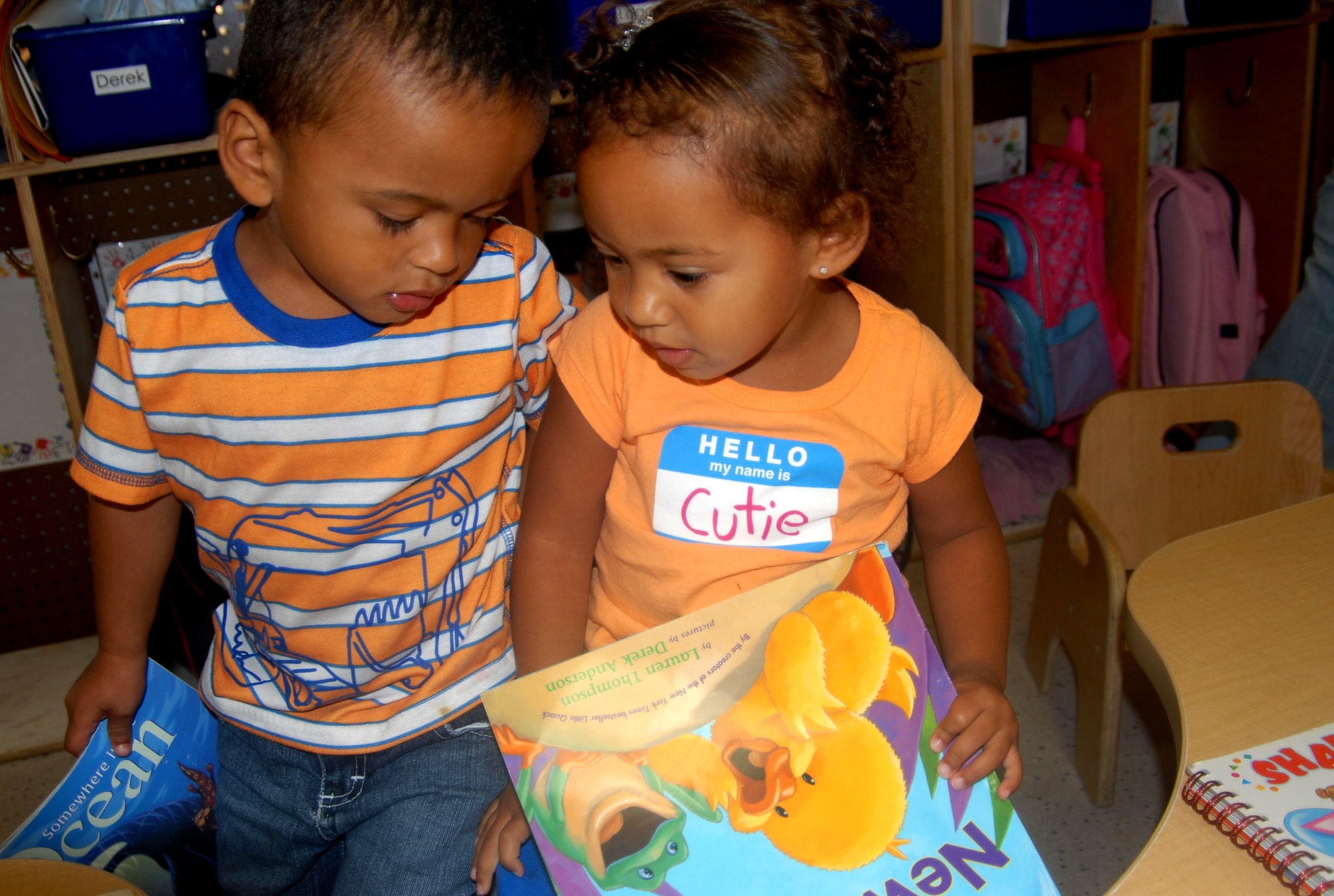 Derek Pangilinan and Mya Smith prepare for story time shortly after nap time at the Edwards Child Development Center. The CDC and the Family Child Care program offer an age-appropriate educational curriculum to children before entering kindergarten. (Photo by Airman 1st Class Mike Young) 
