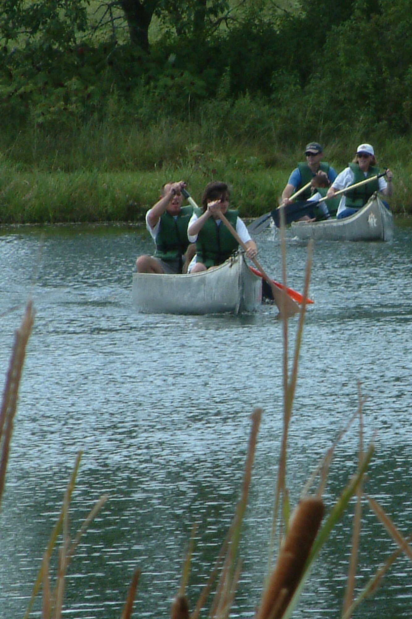 MCCONNELL AIR FORCE BASE, Kan. – A participant in the 22nd Maintenance Group reunion and reintegration retreat tries canoeing in the lake at the Rock Springs 4-H Center, near Junction City, Kan., Aug. 25. Archery, horseback riding, trap and rifle shooting were among some of the activities retreat members could choose from. More than 70 military members, some recently returned from deployment, and their families participated in the event. (U.S. Air Force photo by Tech. Sgt. Chyrece Campbell