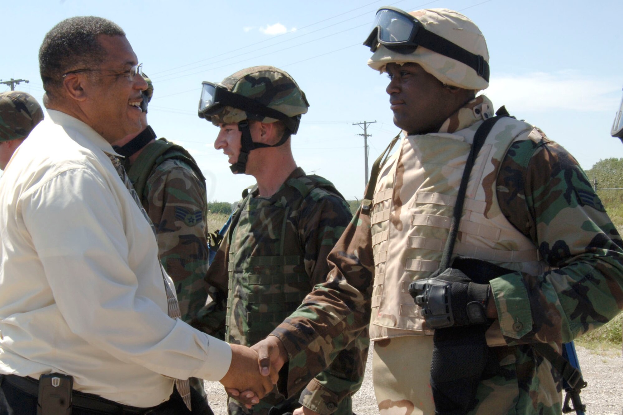 MCCONNELL AIR FORCE BASE, Kan. – Wichita Mayor Carl Brewer shakes hands with Senior Airman Jeremy Williams, 22nd Security Forces Squadron, after observing a Combat Skills Training during his tour at McConnell Aug. 27. (U.S. Air Force Photo by Airman Justin Shelton)