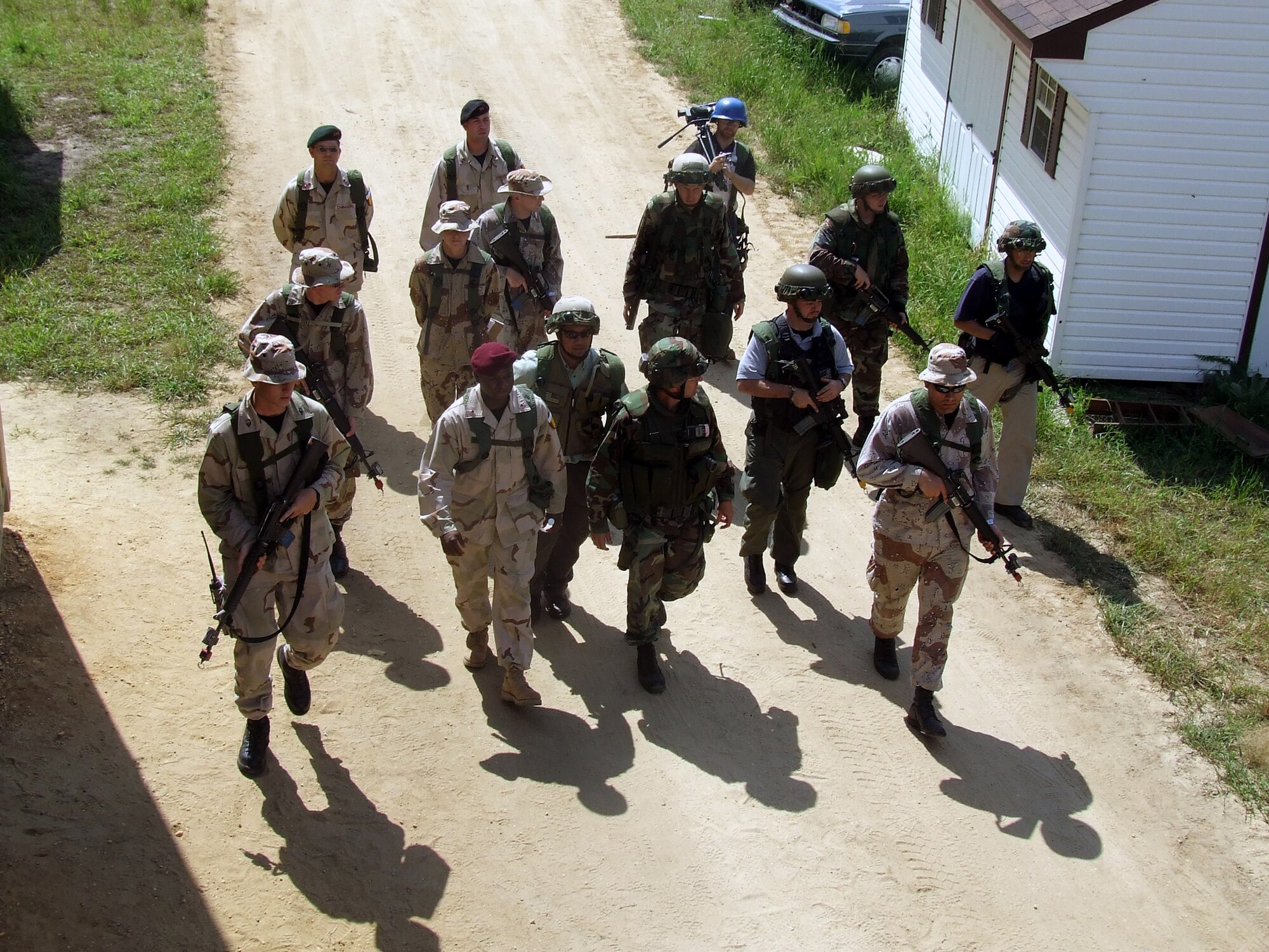 Students and role players hold a scenario in the fictional village of Citheron for Air Force Exercise Eagle Flag 07-6 at Naval Air Engineering Station Lakehurst, N.J., Aug. 27.  The exercise is operated by the U.S. Air Force Expeditionary Center's 421st Combat Training Squadron from Fort Dix, N.J.  (U.S. Air Force Photo/Tech. Sgt. Scott T. Sturkol)
