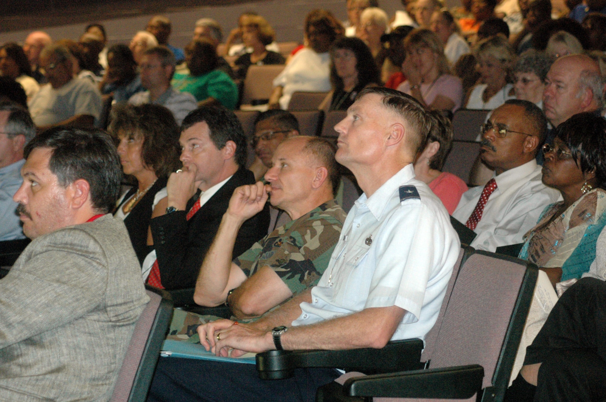 Brig. Gen. Andy Busch, Defense Supply Center Richmond commander (center right, in blues), joins Col. Mark Atkinson, commander of the 402nd Maintenance Wing, and employees during an information session on the transfer process and Oct. 14 standup of the DSCR detachment at Warner Robins Air Logistics Center. (Air Force photo by Sue Sapp)