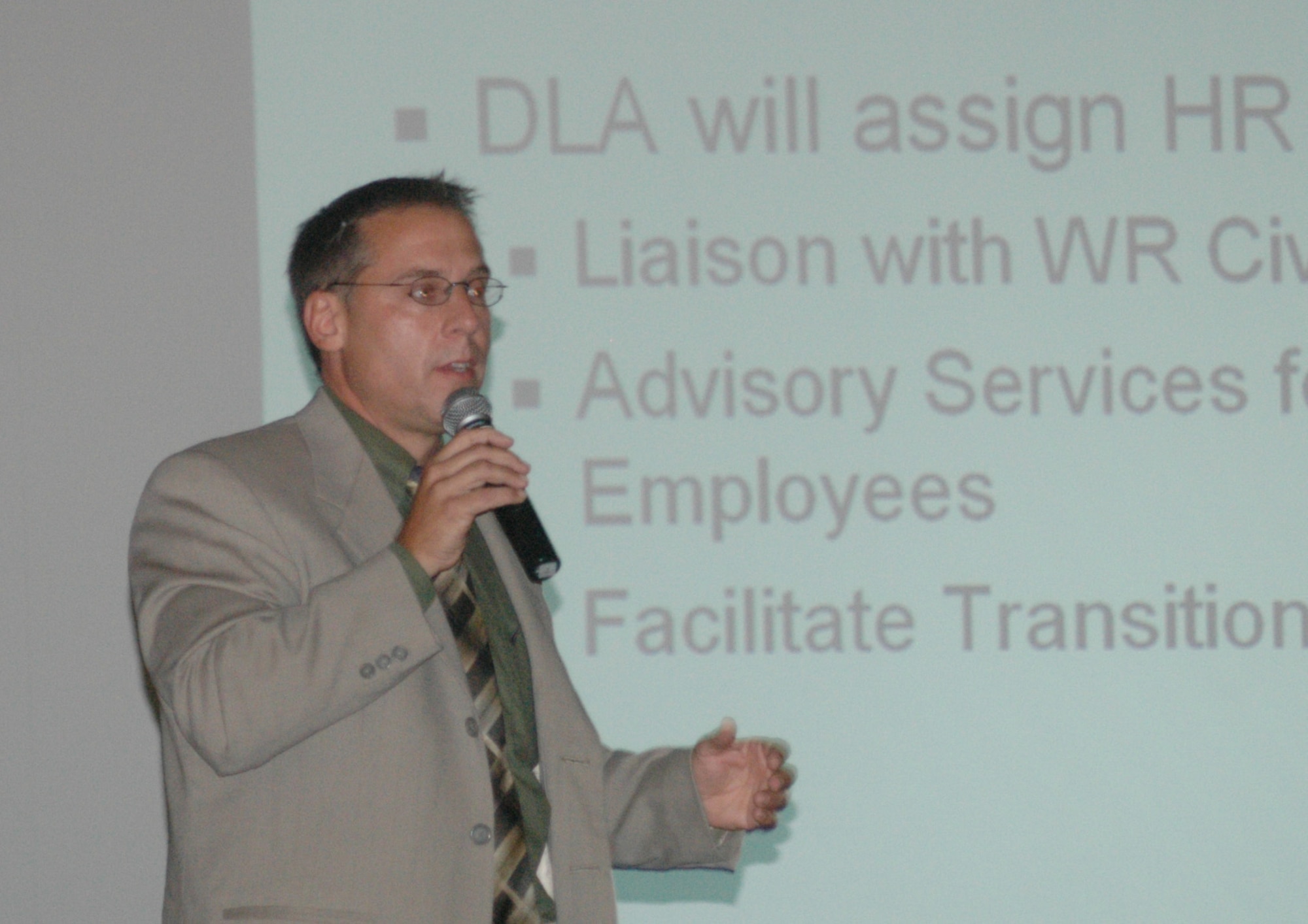 Human resource specialist Ted Singer, from Headquarters Air Force Materiel Command, describes the details of a human resource service provider agreement forged between the Defense Logistics Agency and Air Force Materiel Command and how it impacts employees being realigned to DLA. (Air Force photo by Sue Sapp)