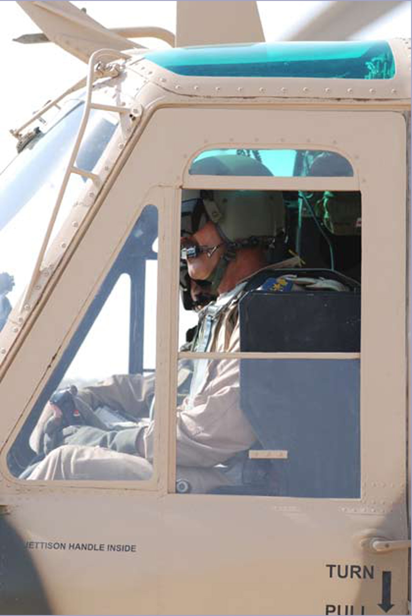 TAJI, Iraq – An Iraqi Air Force pilot based out of Taji, Iraq, lands after completing an electrical powerline patrol Aug. 2. (U.S. Air Force photo / Senior Airman Christie Putz)