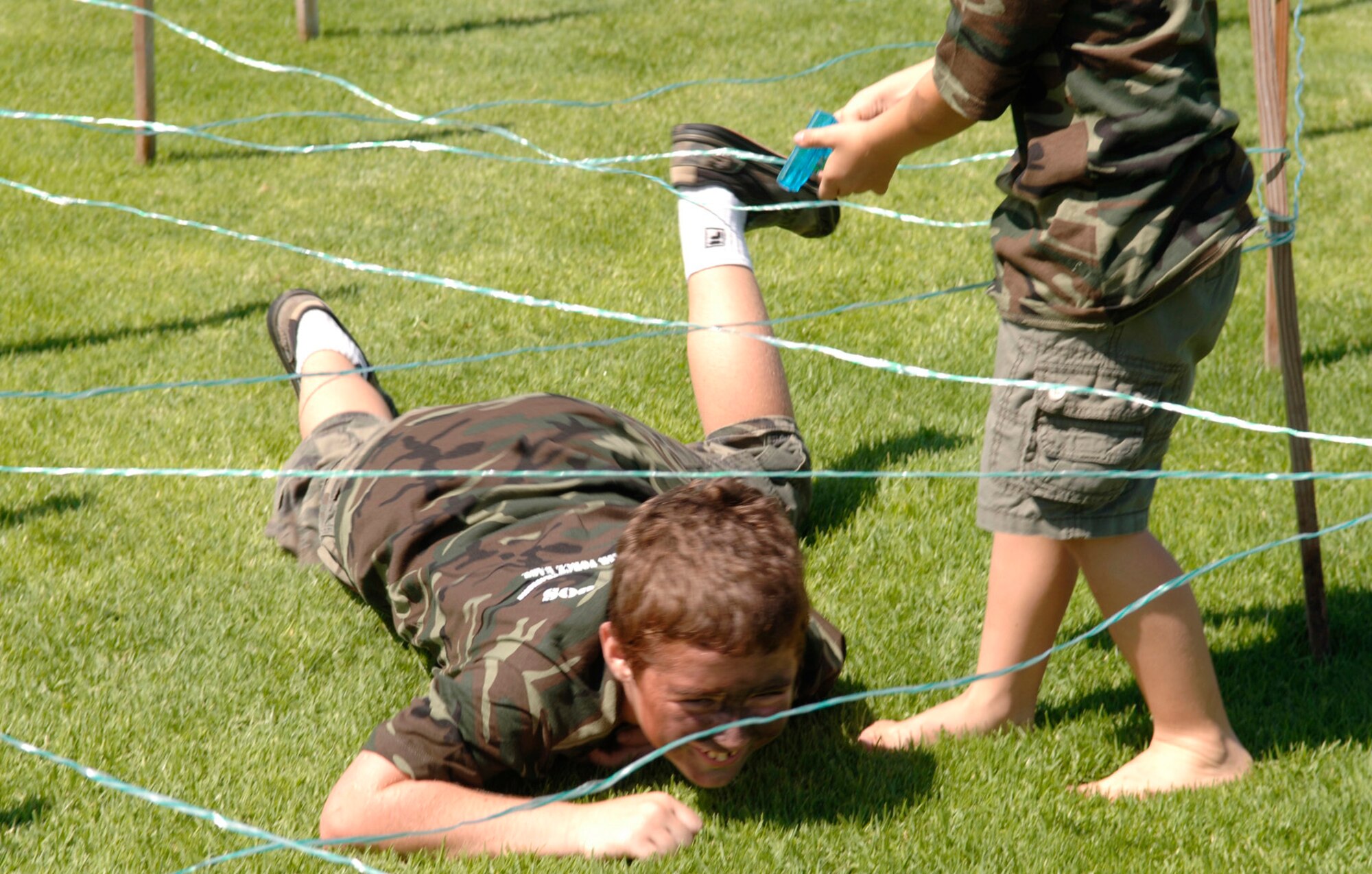 McKinsey Phillips low crawls while being assaulted with a water pistol wielded by an unknown assailant. (Photo by Paul Testerman)
