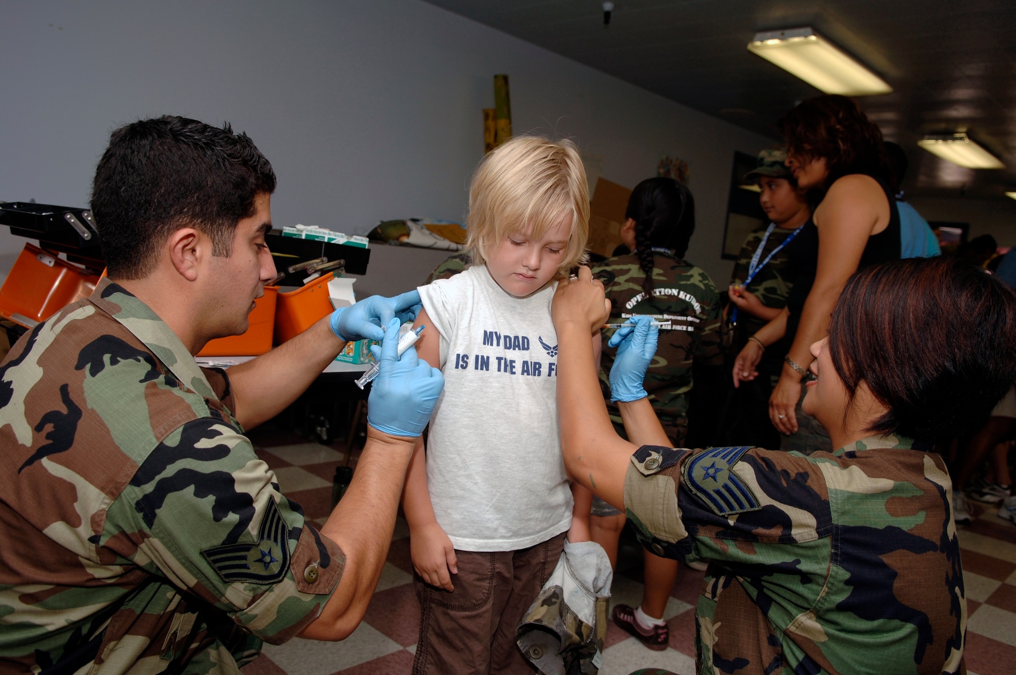 Amilia Dumas, 4, gets her shots during the deployment line. (Photo by Paul Testerman)