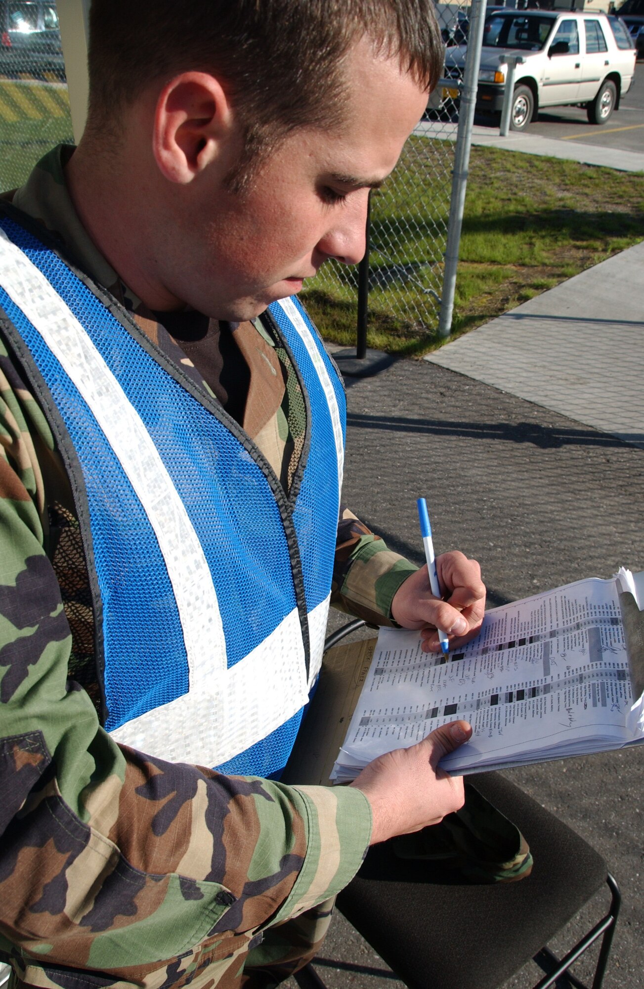 EIELSON AIR FORCE BASE, Alaska --  Airman 1st Class Joshua Emmons, 354th Communications Squadron, checks a security sheet for accountability purposes during Artic Gold 07-06 July 28, 2007 at the Joint Mobility Complex. The main objective for Arctic Gold is to evaluate the Unit Control Center stand up, personnel accountability, processing of personnel and cargo, and force protection condition/information condition practices.  (U.S. Air Force photo by Airman 1st Class Christopher Griffin)(Released)