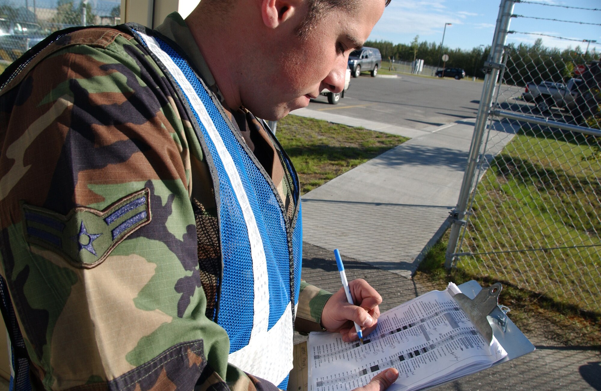 EIELSON AIR FORCE BASE, Alaska --  Airman 1st Class Joshua Emmons, 354th Communications Squadron, checks a security sheet for accountability purposes during Artic Gold 07-06 July 28, 2007 at the Joint Mobility Complex. The main objective for Arctic Gold is to evaluate the Unit Control Center stand up, personnel accountability, processing of personnel and cargo, and force protection condition/information condition practices.  (U.S. Air Force photo by Airman 1st Class Christopher Griffin)(Released)