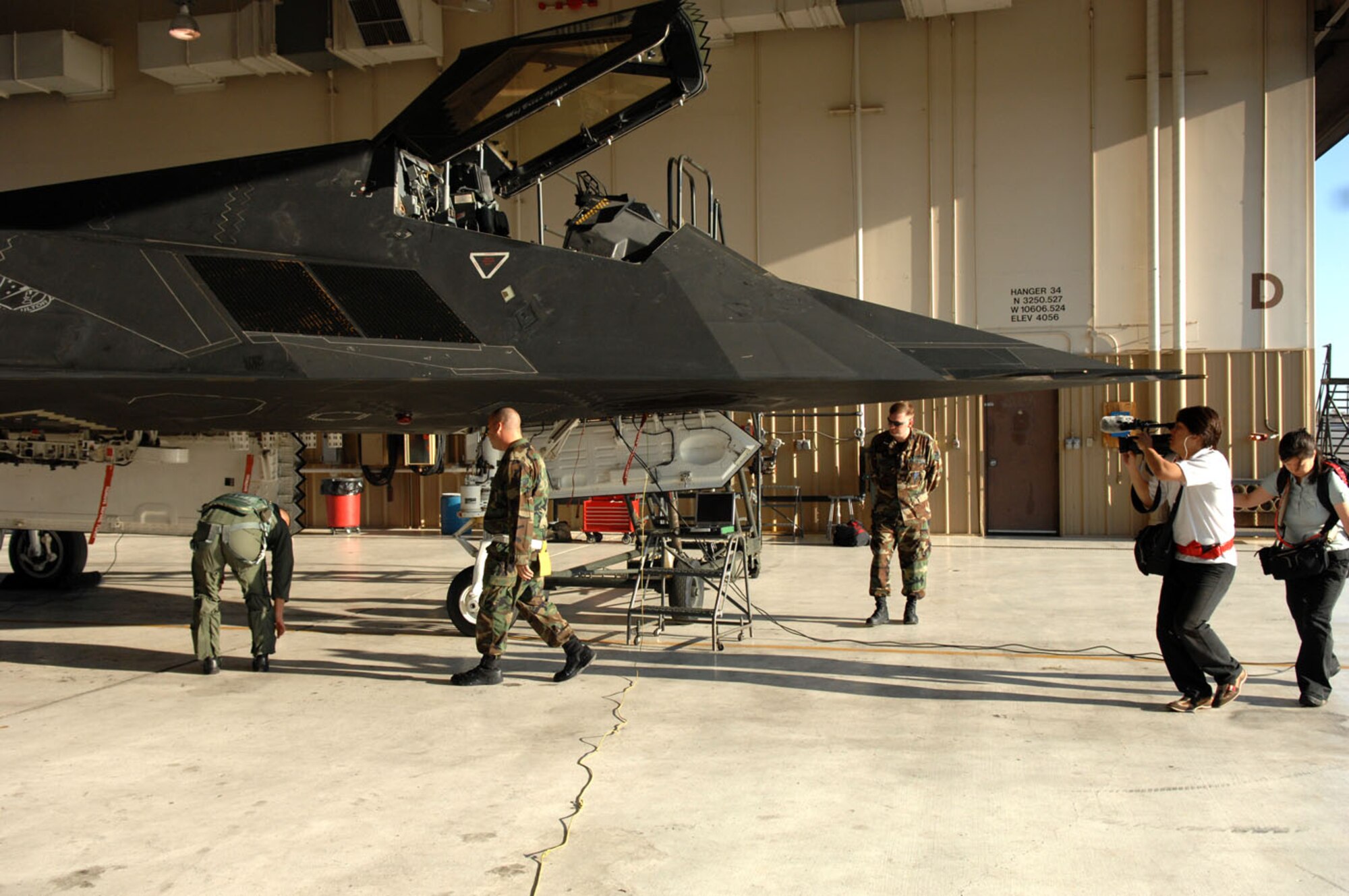 A Japanese news crew documents the F-117A Nighthawk as a tribute to its retirement and history. (U.S. Air Force photo/Senior Airman Anthony Nelson)