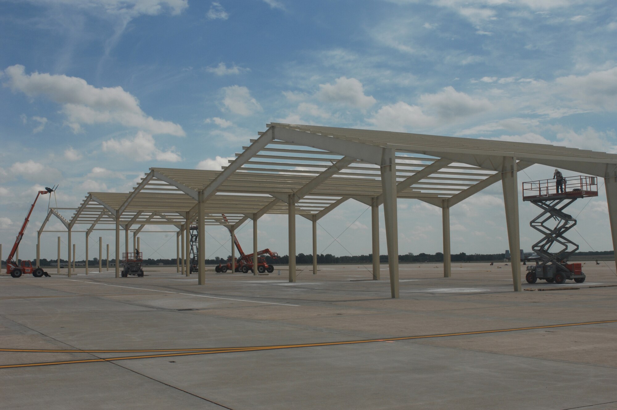 WHITEMAN AIR FORCE BASE, Mo., -- Shelters are being constructed for the 442nd Fighter Wing A-10 s between the A-10 maintenance hangers and the 509th Bomb Wing B-2 docks. Due to the 2005 realignment, whiteman had an increase of aircraft it did not have enough hanger space for. The shelters will be used for maintenance on the A-10’s during increment weather. (U.S. Air Force Photo/Tech Sgt. Samuel Park)