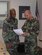 Master Sgt. Justin Patton reviews some paperwork with Chief Master Sgt. Gordon Caviness.  Sergeant Patton is the first seergeant with the 916th Security Forces Squadron and Chief Caviness is security forces manager with the same squadron.