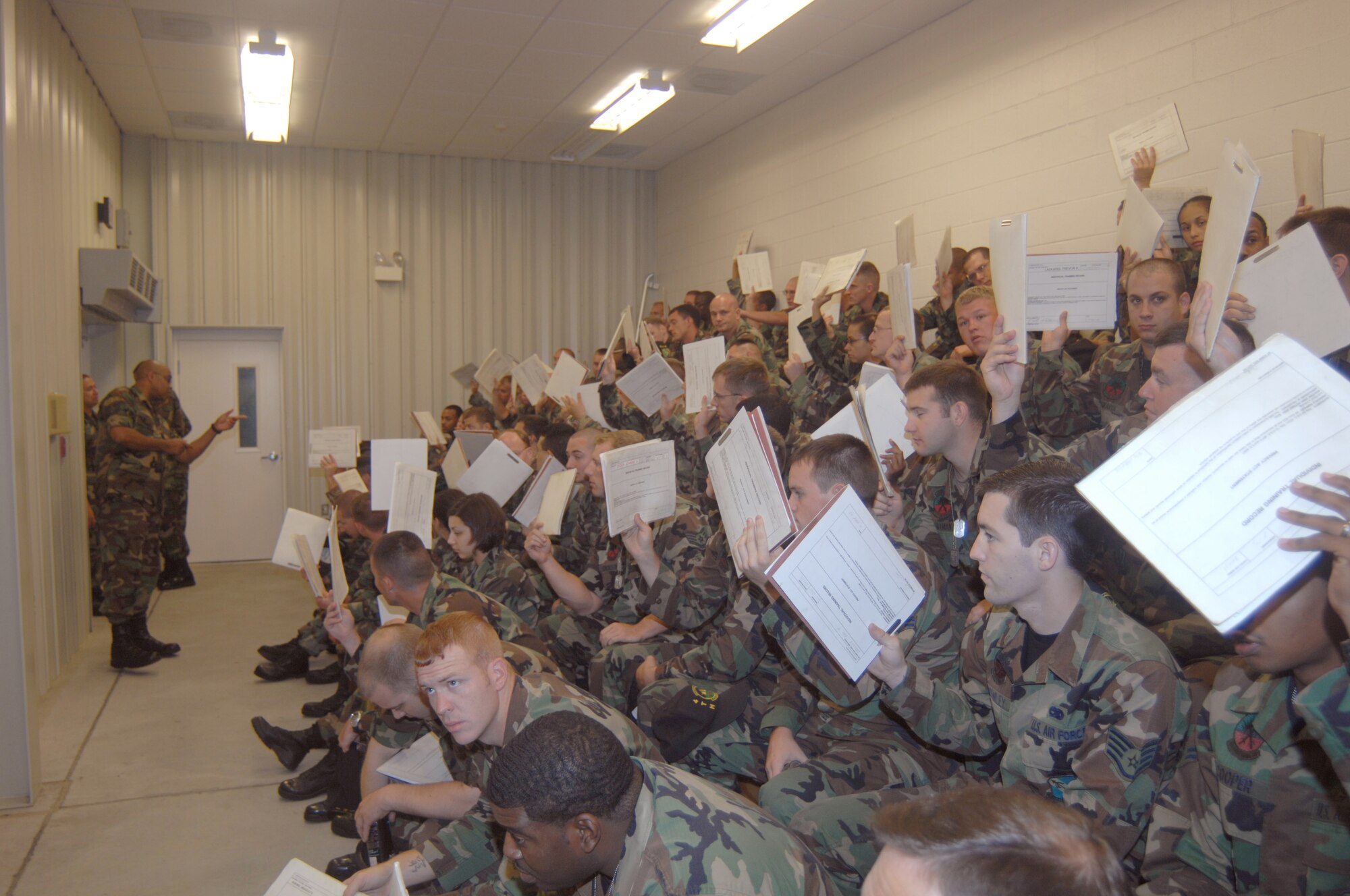 SEYMOUR JOHNSON AIR FORCE BASE, N.C. - Technical Sergeant Wayne Powell, 4th Mission Support Squadron, briefs Airmen from Seymour Johnson Air Force Base to make sure they have all they records and affairs in order to deploy, during processing at Seymour Johnson Air Force Base Aug. 29, 2007.  More than 600 4th FW Airmen will deploy in the next few months. (U.S. Air Force photo by Senior Airman Chad Trujillo)