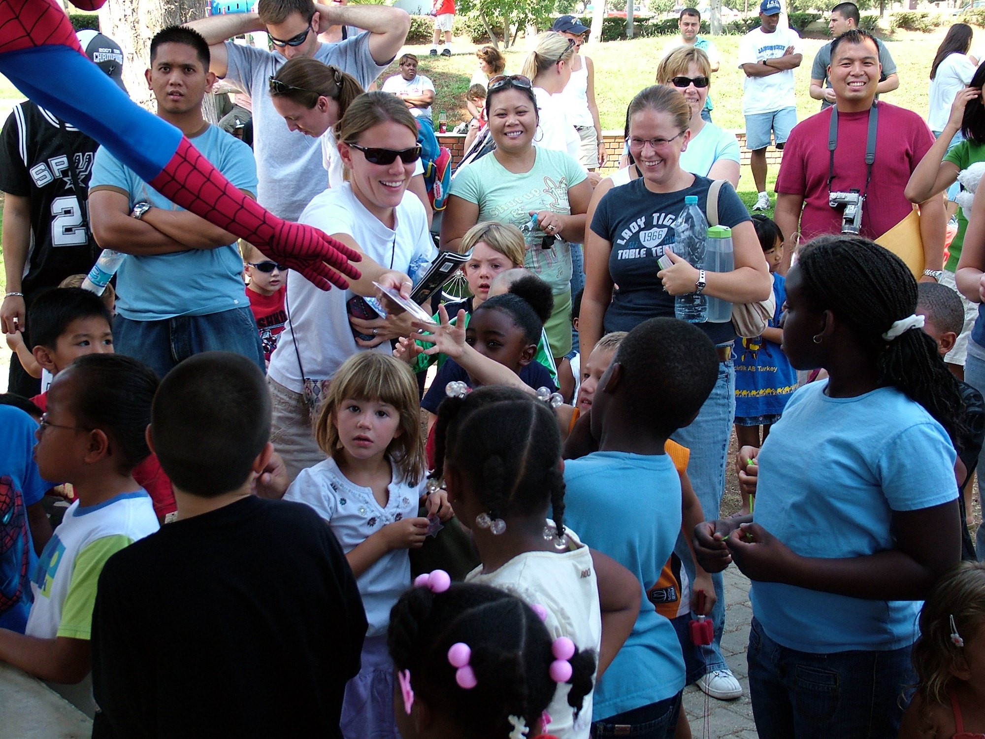 Spiderman hands out prizes to his fans at Incirlik's Arkadas park Aug. 25. All children that attended Spiderman’s visit got prizes, about 350-400 kids showed up at the various locations. (U.S. Air Force photo by Jodi Whitener)
