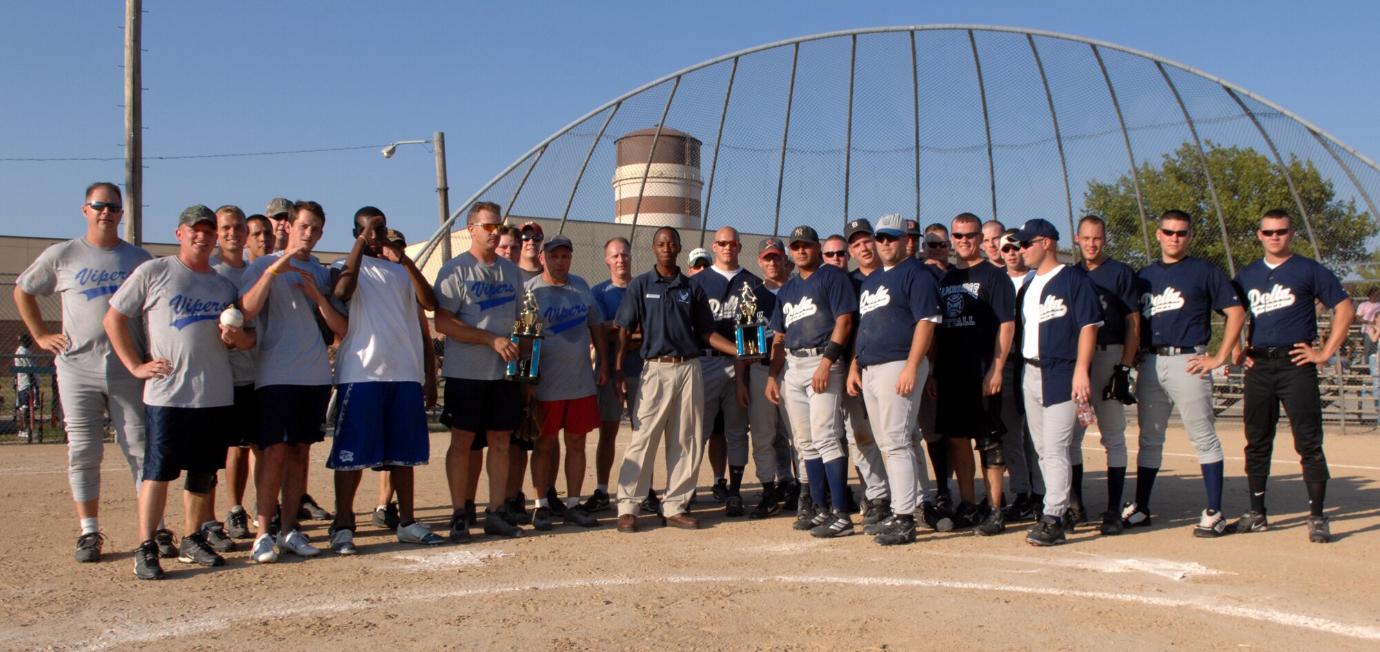 WHITEMAN AIR FORCE BASE, Mo. – The 509th Maintenance Squadron Vipers and the 509th Security Forces Squadron Delta Flight “Delta Dawgs”, pose for a photo after the 2007 men’s intramural softball finals Aug. 27. The Vipers struck down the Dawgs 10-6.  (U.S. Air Force photo/Airman 1st Class Stephen Linch)