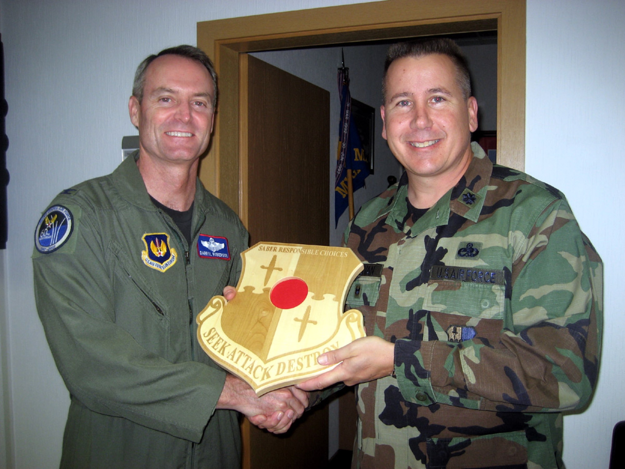 SPANGDAHLEM AIR BASE, Germany – Col. Darryl Roberson, 52nd Fighter Wing commander, presents a Responsible Choices plaque to Lt. Col. Edward Sullivan, 52nd Maintenance Group deputy commander, at the 52nd MXG office Aug. 28. (U.S. Air Force photo/Staff Sgt. Andrea Knudson)