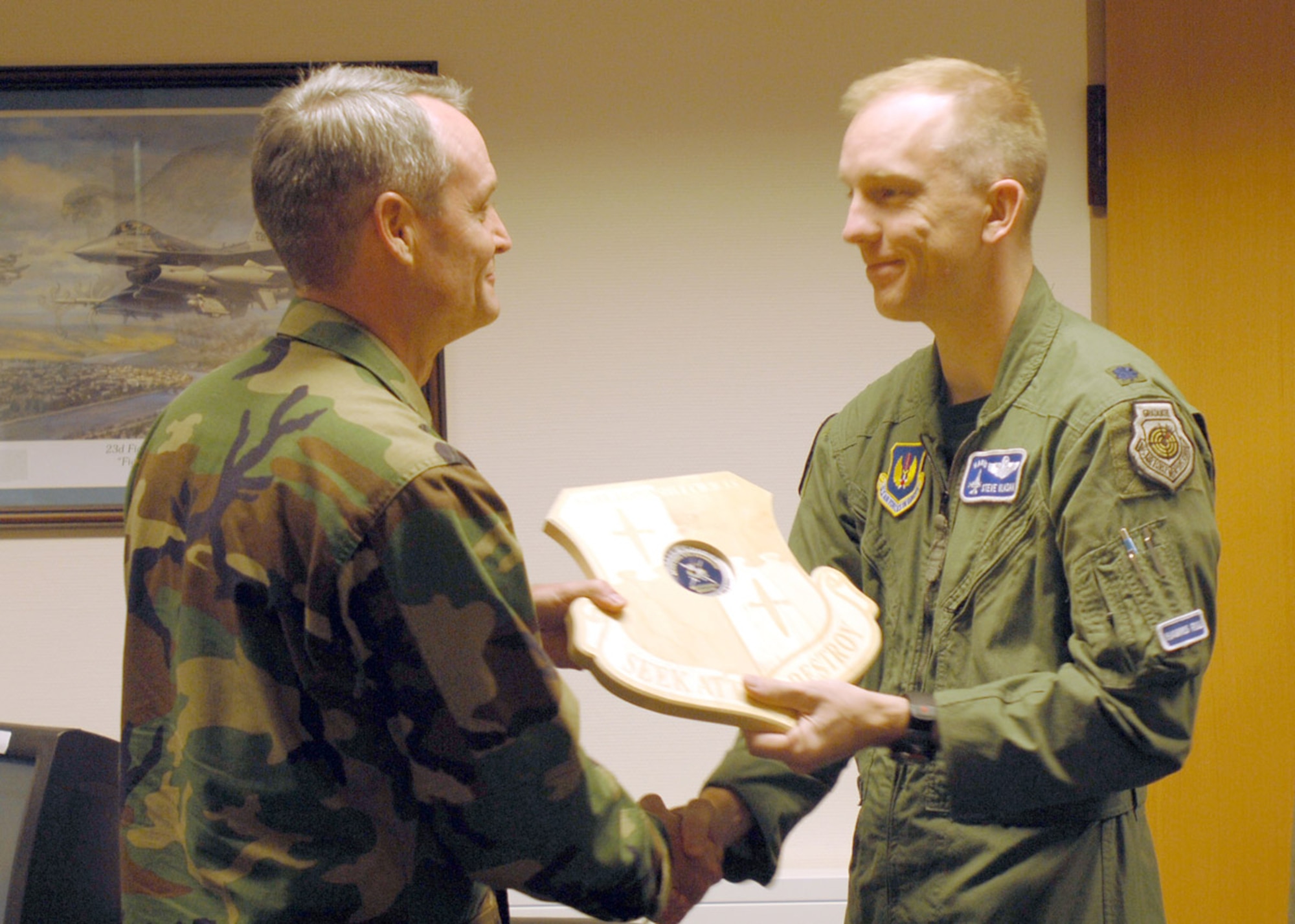 SPANGDAHLEM AIR BASE, Germany – Col. Darryl Roberson, 52nd Fighter Wing commander, presents a Responsible Choices plaque to Lt. Col. Steven Vlasak, 23rd Fighter Squadron commander, at the 52nd Operations Group office Aug. 29. (U.S. Air Force photo/Senior Airman Josie Kemp)