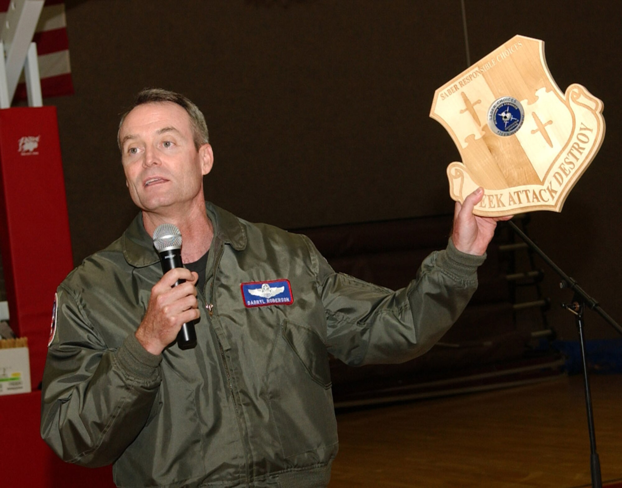 SPANGDAHLEM AIR BASE, Germany – Col. Darryl Roberson, 52nd Fighter Wing commander, presents 52nd FW groups and squadron commanders their Responsible Choices plaques Aug. 28-29. The plaques are housed with the respective commanders at their units. A coin is fixed to the plaque and will remain intact unless a member from the unit receives a DUI or ARI. The member who receives the DUI or ARI will personally return the coin to the wing commander. (U.S. Air Force photo/Airman 1st Class Allen Pollard)