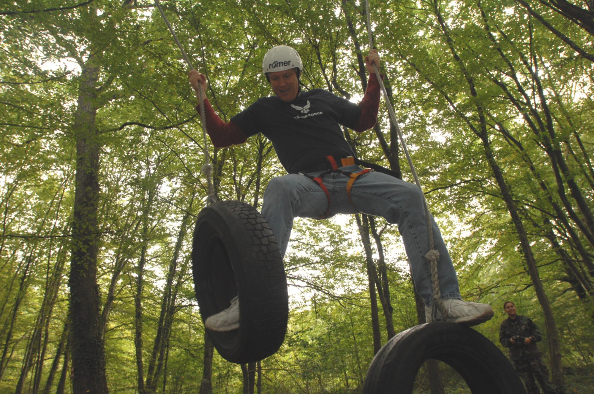 SPANGDAHLEM AIR BASE, Germany – Chief Master Sgt. Vance Clarke, 52nd Fighter Wing command chief, navigates his way through a swing obstacle during a ropes course Aug. 27. The course is designed to build team spirit and help its participants learn more innovative ways to work together to accomplish their mission. (U.S. Air Force photo/Senior Airman Josie Kemp)