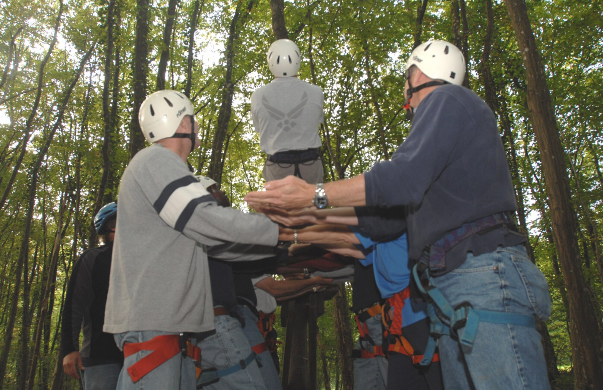 SPANGDAHLEM AIR BASE, Germany – Senior leadership from the 52nd Fighter Wing prepare to catch one of their team members during a “trust fall” exercise before beginning a ropes course Aug. 27. The course is designed to build team spirit and help its participants learn more innovative ways to work together to accomplish their mission. (U.S. Air Force photo/Senior Airman Josie Kemp)