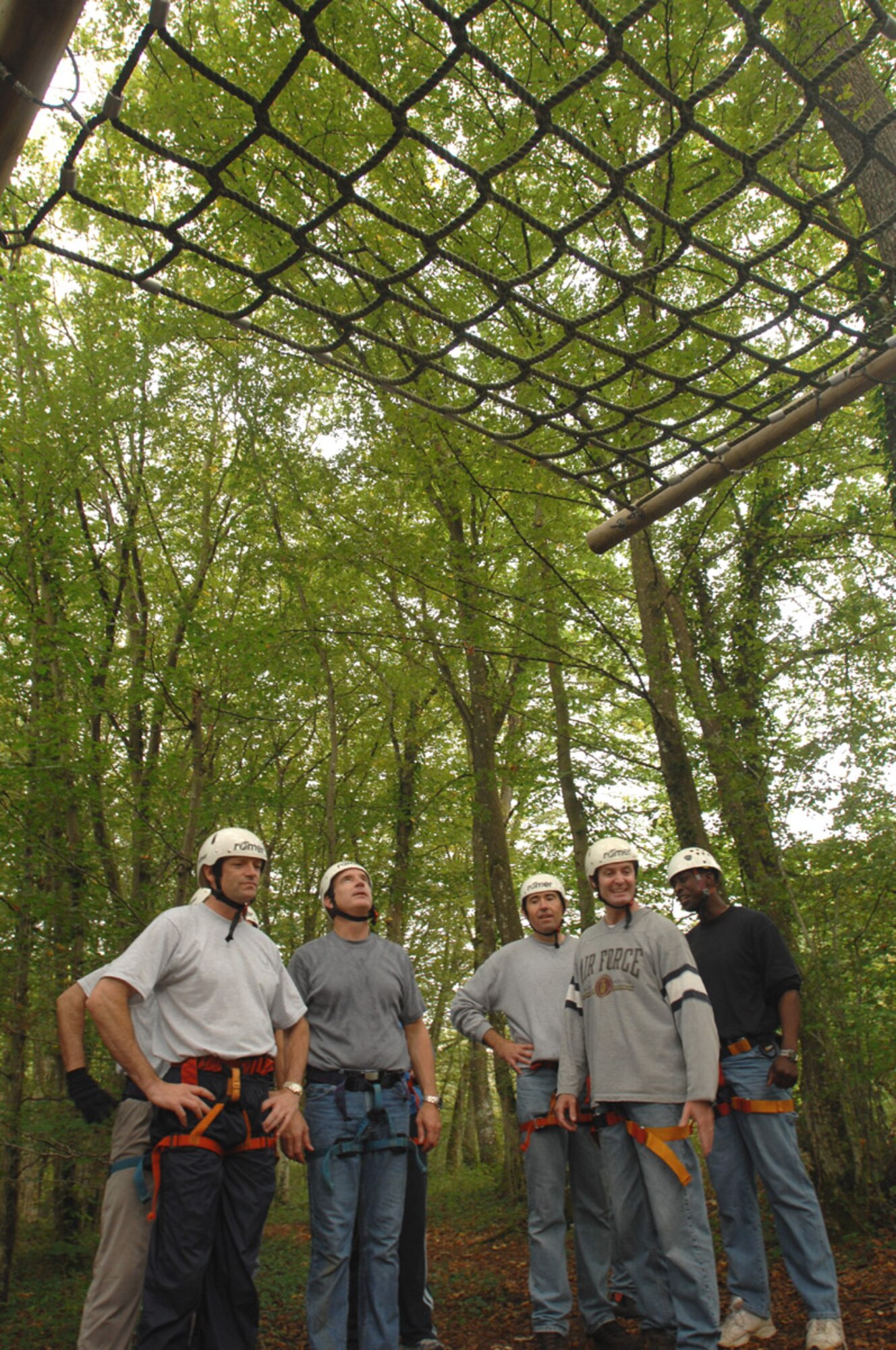SPANGDAHLEM AIR BASE, Germany – Senior leadership from the 52nd Fighter Wing wait to begin an obstacle during a ropes course Aug. 27. The course is designed to build team spirit and help its participants learn more innovative ways to work together to accomplish their mission. (U.S. Air Force photo/Senior Airman Josie Kemp)