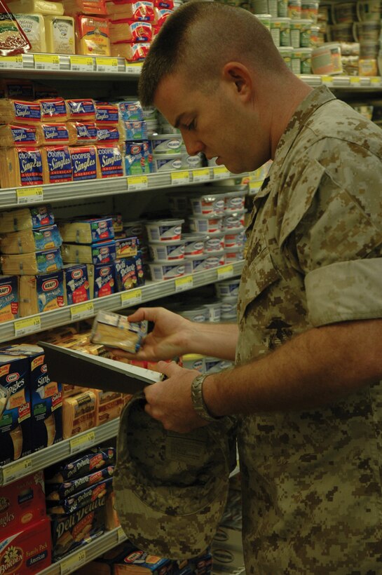 Sgt. Sean Sweeney, Headquarters and Headquarters Squadron Intermediate Maintenance Activity and student in the station?s Nutrition 101 class, looks for items during a scavenger hunt at the station commissary Aug. 30.