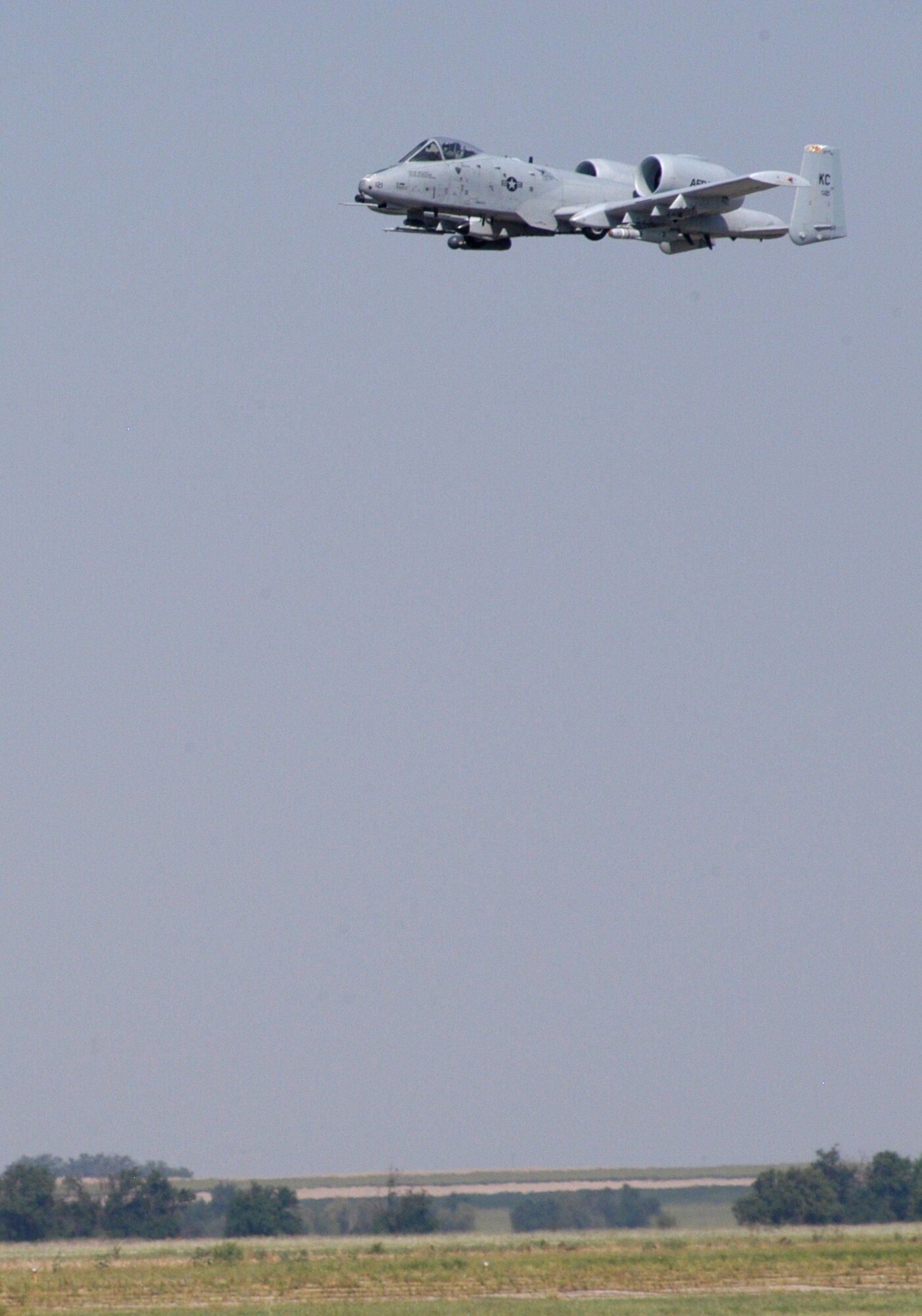 An A-10 Thunderbolt II from the 442nd Fighter Wing's 303rd Fighter Squadron makes a low approach at Salina Municipal Airport in Salina, Kan., Aug. 16, 2007.  Many Air Force aircraft utilize the Salina airport for procedural training due to its proximity to the Smoky Hill bombing and gunnery range.  (U.S. Air Force photo/Maj. David Kurle)