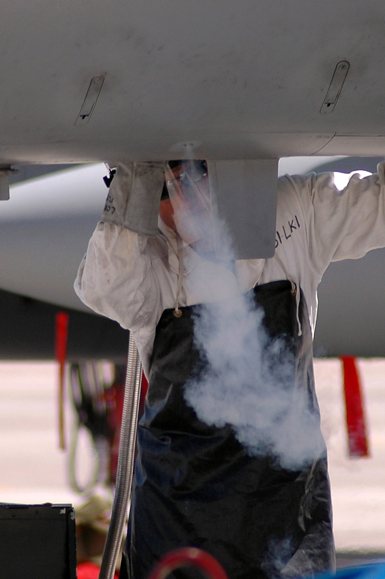 Crew chief Senior Airman Joe King fills a liquid oxygen tank on an F-15 Eagle during the Red Flag 07-3 exercise Aug. 28 at Nellis Air Force Base, Nev. Servicemembers from all the U.S. military branches, along with coalition forces, are participating in the event. Airman King is assigned to the Air National Guard's 142nd Fighter Wing at Portland, Ore. (U.S. Air Force photo/Tech. Sgt. Bob Sommer)