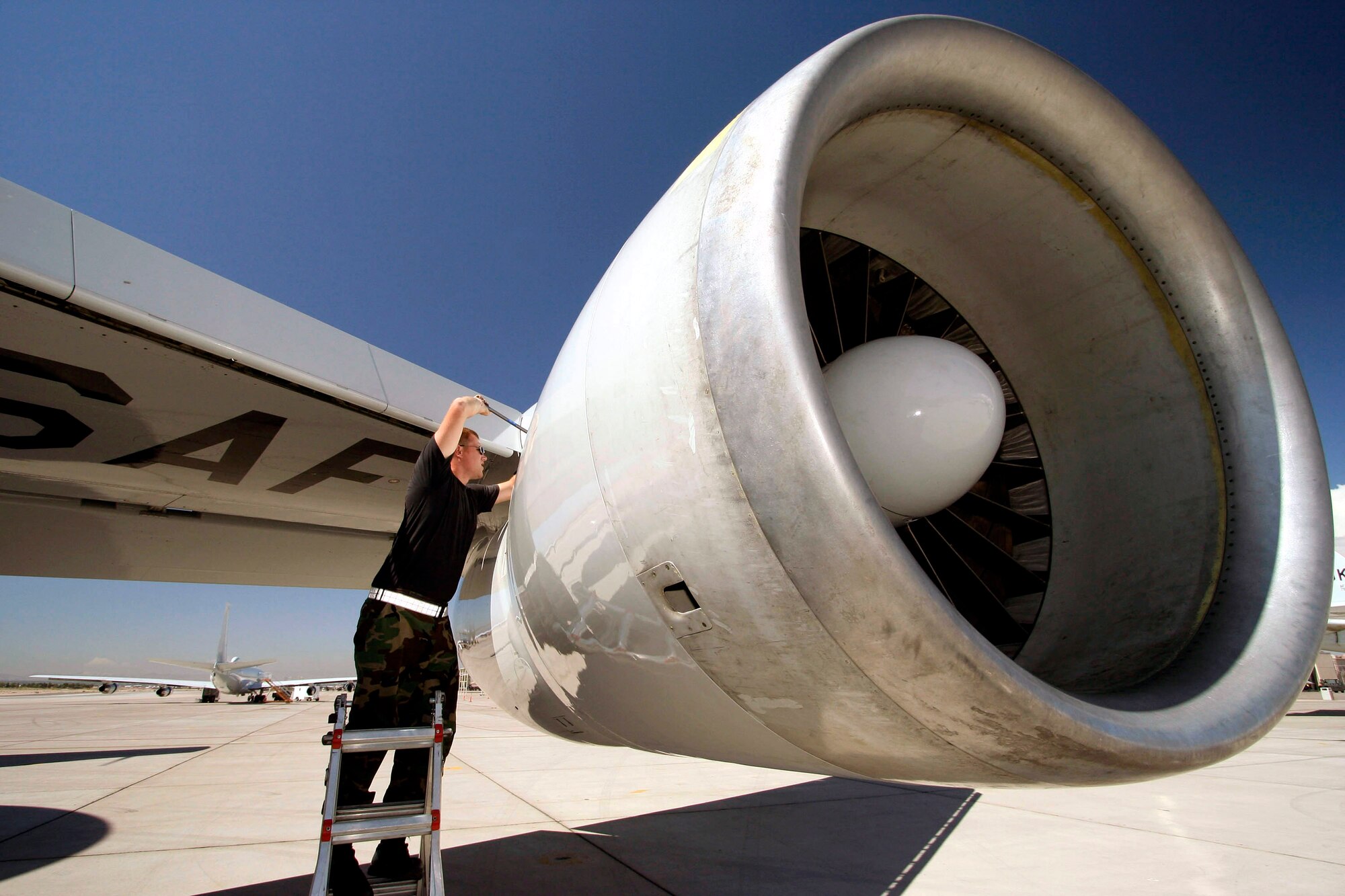 Before a launch, crew chief Staff Sgt. Jesse Taylor primes an E-3 Airborne Control and Warning System aircraft's engine during the Red Flag 07-3 exercise Aug. 28 at Nellis Air Force Base, Nev. Servicemembers from all the U.S. military branches, along with coalition forces, are participating in the event. Sergeant Taylor is assigned to the 552nd Air Control Wing at Tinker AFB, Okla. (U.S. Air Force photo/Tech. Sgt. Patrick M. Kuminecz)