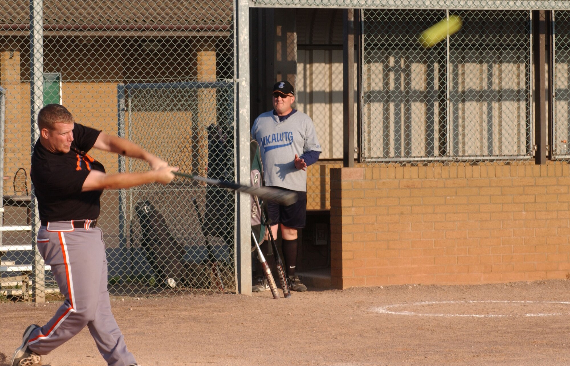 Adam Jesse, from the 727th Air Mobility Squadron, swings at a pitch which resulted in a home run during the 2007 RAF Mildenhall softball intramural semi-final championship game against the 100th Operation Group, Aug. 29, 2007, at RAF Lakenheath. (U.S Air Force photo By Airman Brad Smith)