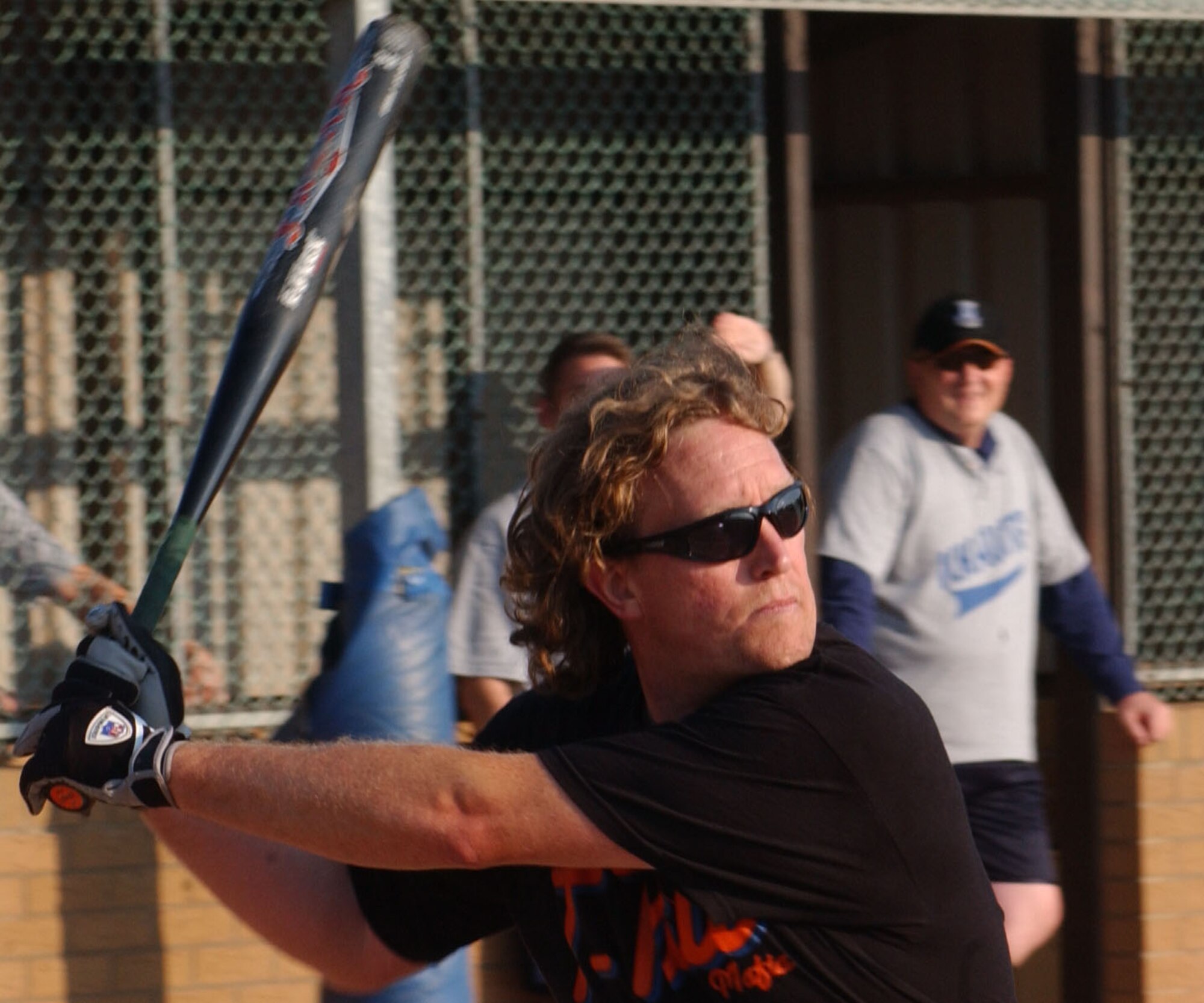 Nicholas Smith, from the 727th Air Mobility Squadron, watches a pitch in the 2007 RAF Mildenhall softball intramural semi-final game played against the 100th Operation Group, Aug. 29, 2007, at RAF Lakenheath. (U.S Air Force photo By Airman Brad Smith)