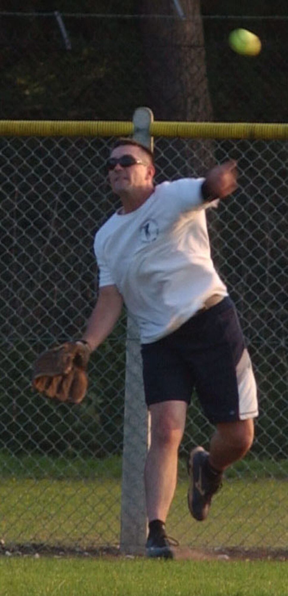 Derek Bussard, from the 352nd Maintenance Squadron, throws from deep outfield to cut off the opposing team runner in the 2007 RAF Mildenhall softball championship game played against the 100th Operations Group, Aug. 29, 2007, at RAF Lakenheath. (U.S. Air Force photo by Airman Brad Smith)