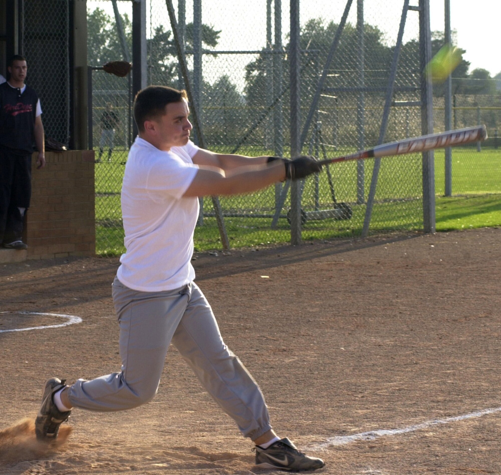 Wade Melick, from the 100th Civil Engineering Squadron, swings at a pitch during the 2007 RAF Mildenhall softball intramural semi-final game played against the 352nd Maintenance Squadron Team, Aug. 29, 2007, at RAF Lakenheath. (Air Force photo By Gary Rogers)