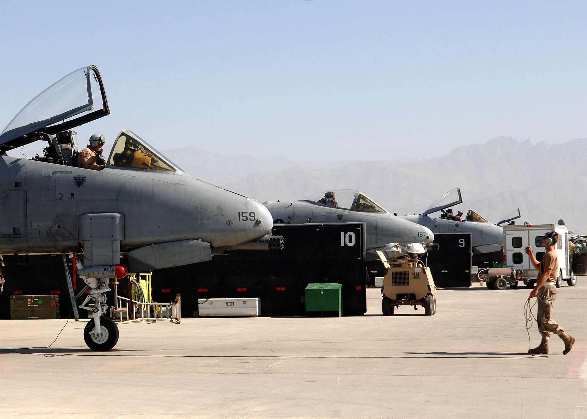 BAGRAM AIRFIELD, Afghanistan -- Maj. James Barlowe, 354th Expeditionary Fighter Squadron A-10 pilot, watches his crew chief for the signal to begin taxiing his jet prior to a flight from Bagram Airfield, Afghanistan. Maj. Barlowe is deployed from Davis-Monthan Air Force Base, Ariz. (U.S. Air Force photo by Staff Sgt. Craig Seals)