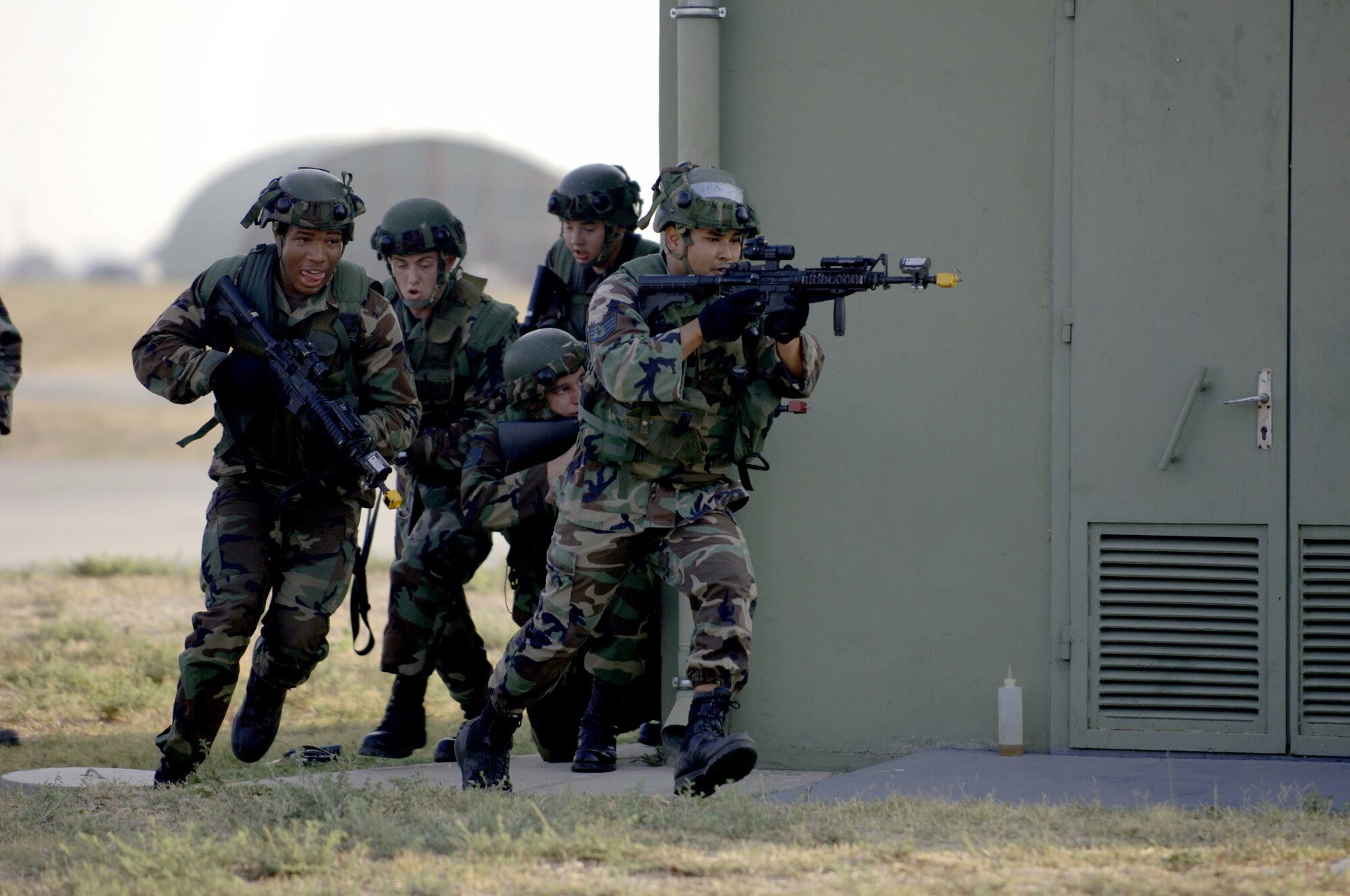 Airmen of the 39th Security Forces Squadron move in on Opposing Forces during a Force on Force exercise at on the flight line Aug. 21. Exercises like these allow the Airmen of the 39th SFS to continually improve their combat tactics in a safe environment. (U. S. Air Force photo by Airman 1st Class Nathan Lipscomb)(RELEASED)