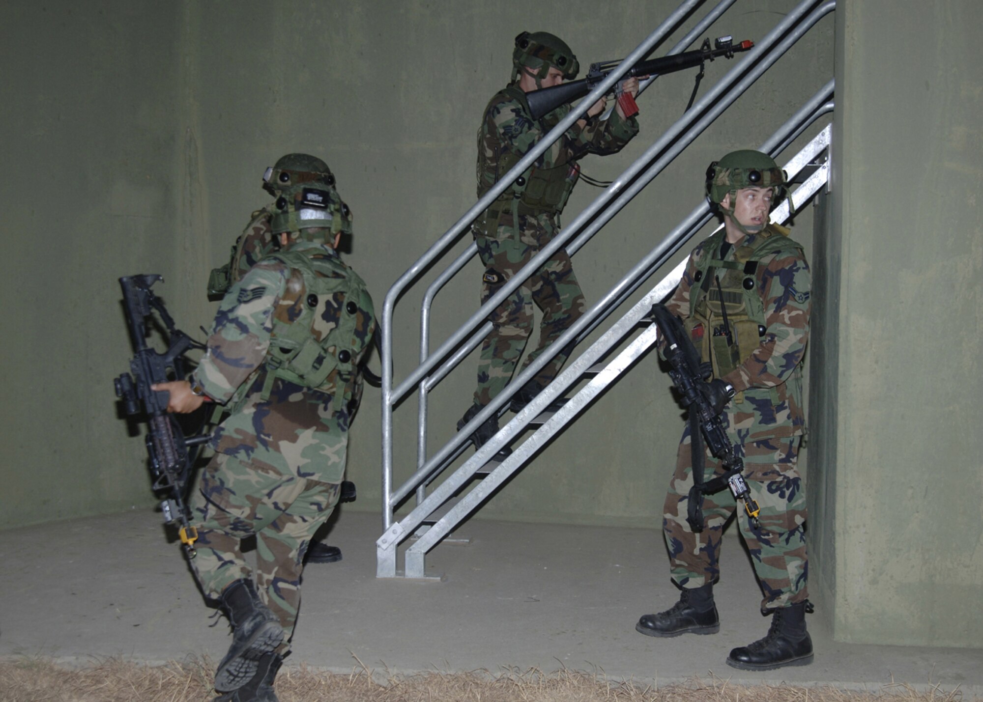 Members of the 39th Security Forces Squadron night shift search the area during a force on force recapture exercise Aug. 21. The exercise allows the Airmen to increase their proficiency. (U.S. Air Force photo by Senior Airman Tiffany Colburn)(RELEASED)